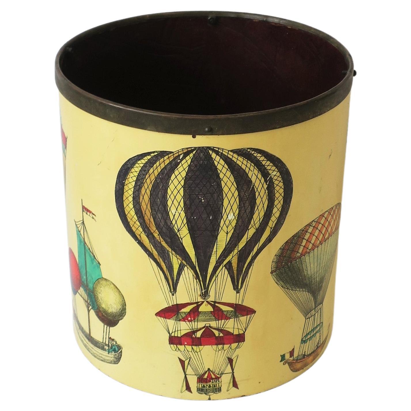 A beautiful and rare Italian wastebasket trash can with colorful hot air balloon design by Piero Fornasetti, circa mid-20th century, 1950s, Italy. Marked on bottom as shown in last two images, images #13 and 14. Collectable design, and a great piece