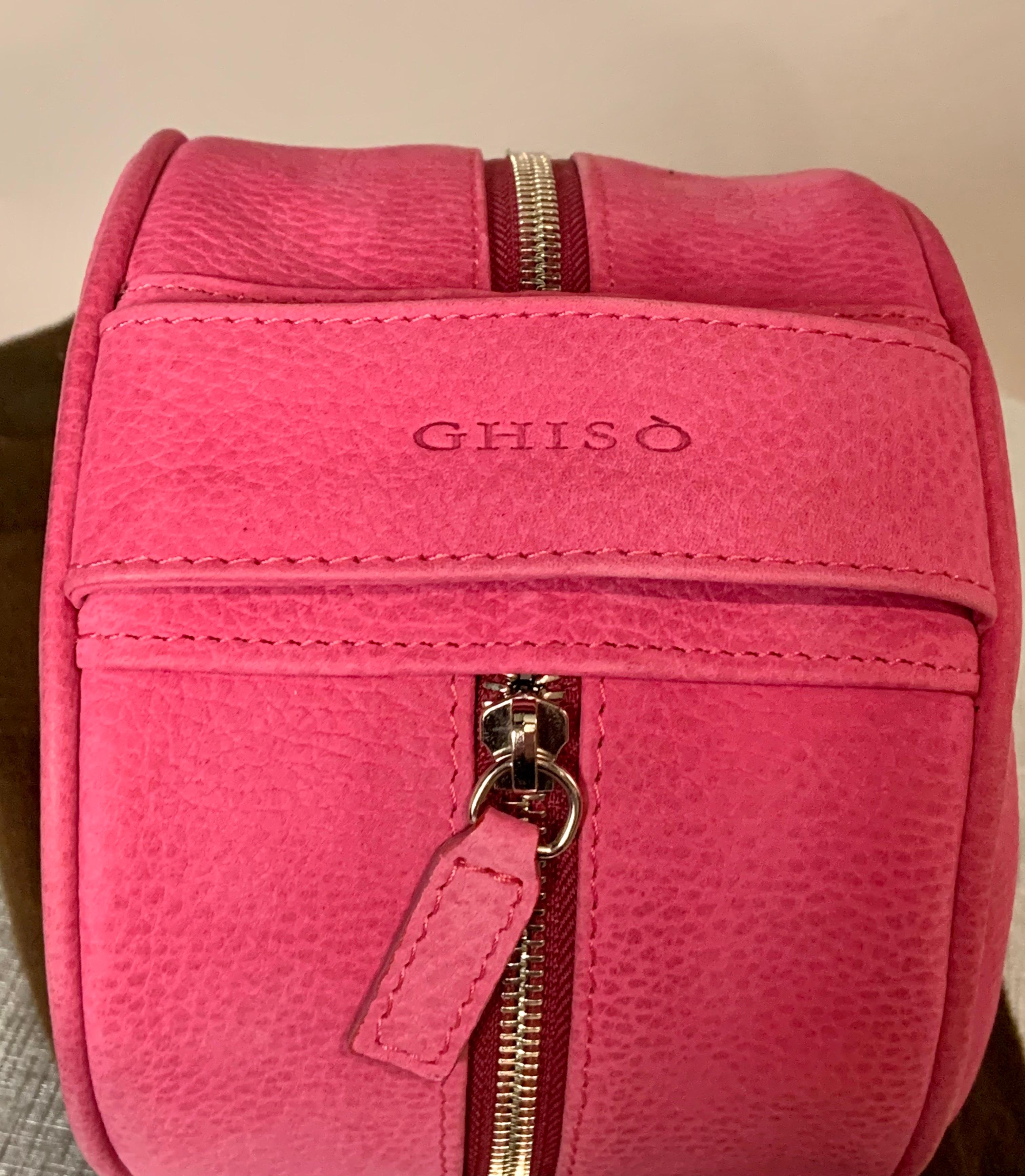 This is the cutest pet accessory, a Barbie pink leather case for your traveling pet. It zips open at the center, and one side has a shiny stainless steel pet food and/or water bowl.  The other side has a pink leather strap snapped in place  to