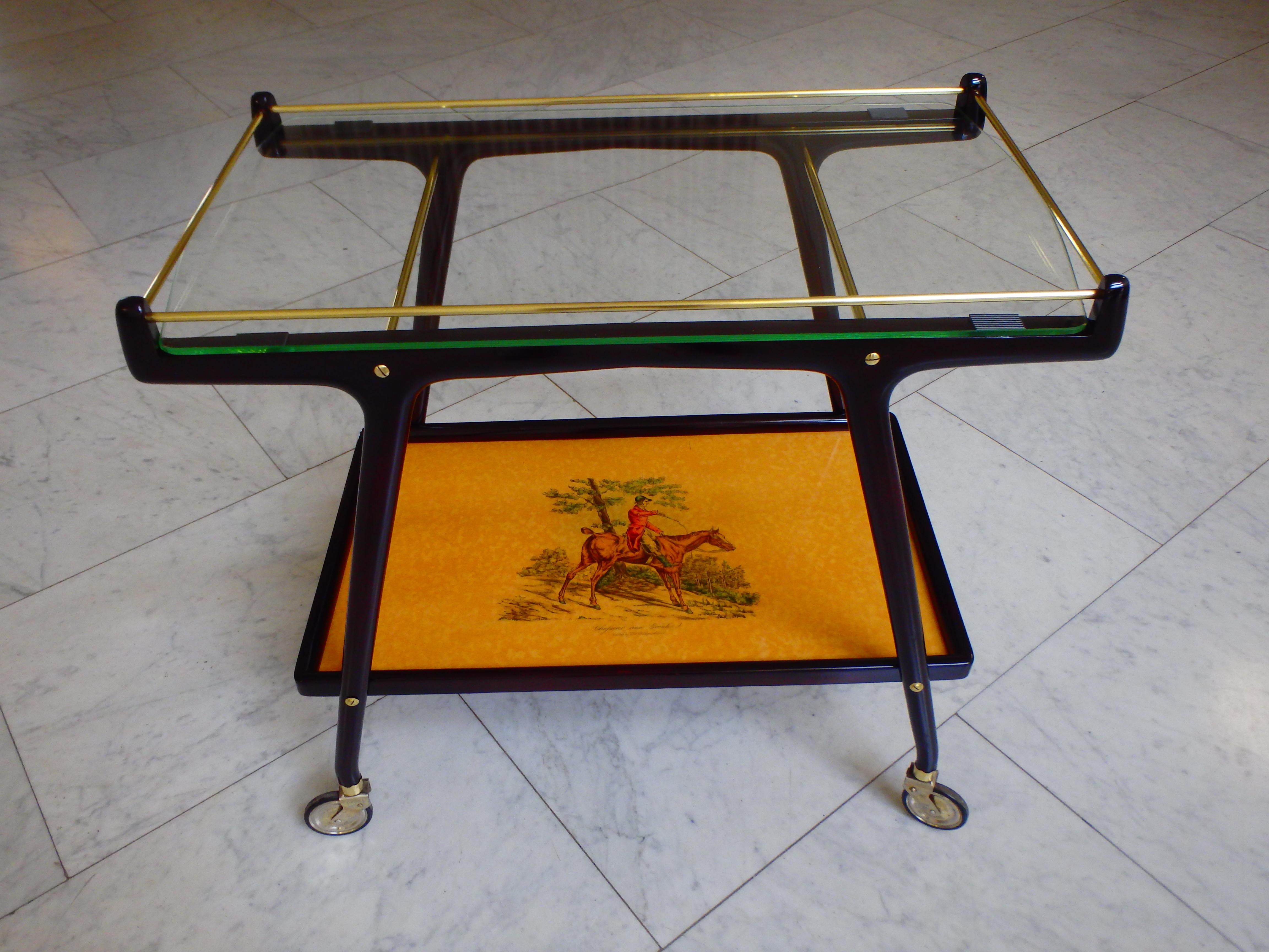 Italian Ico Parisi bar cart with glass top and chase scene.
