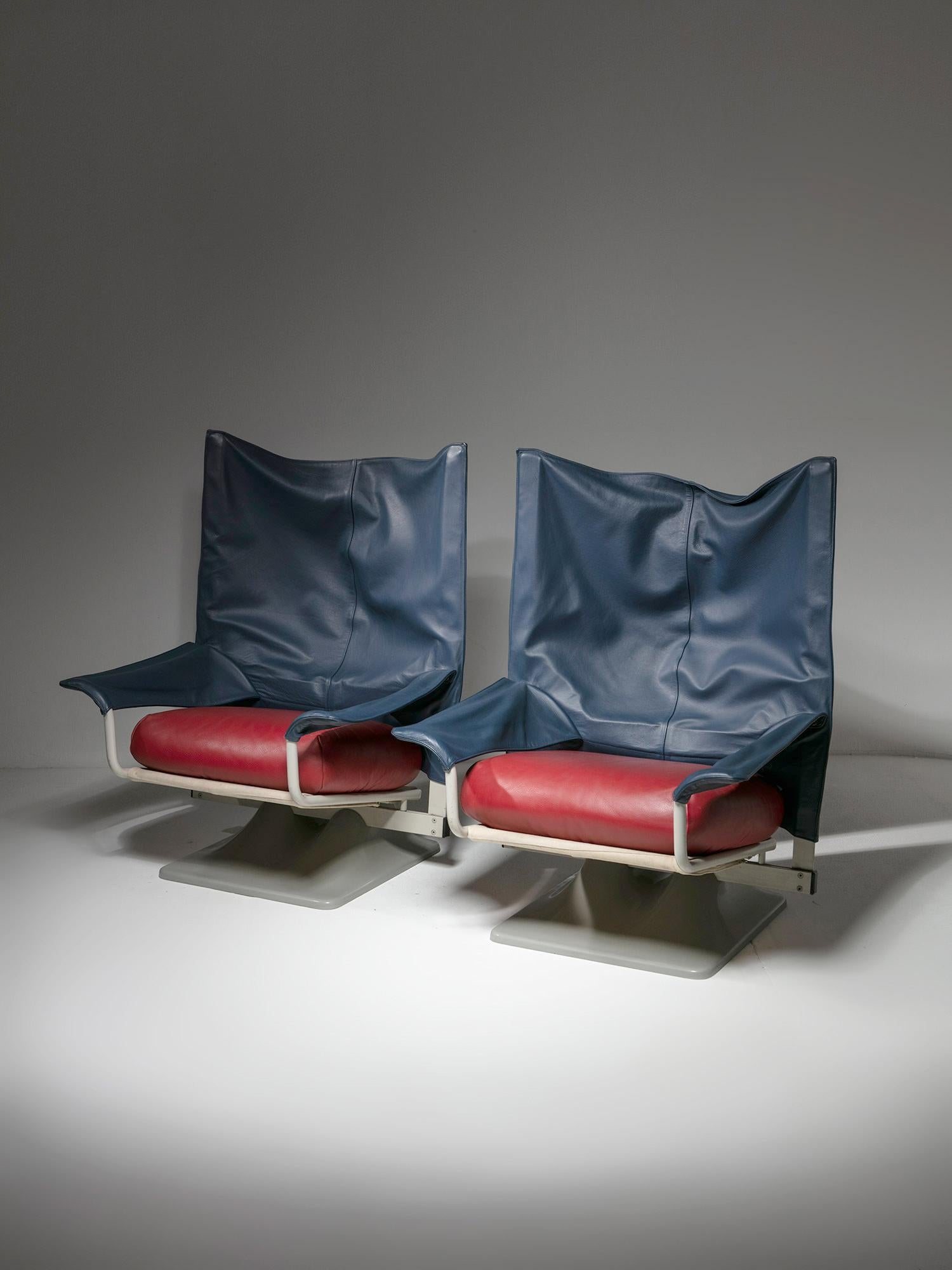 Pair of AEO leather lounge chairs by Archizoom Associati for Cassina.
Plastic organic-shaped base, red pillow, blue backseat and lacquered metal frame for this extremely comfortable seat.