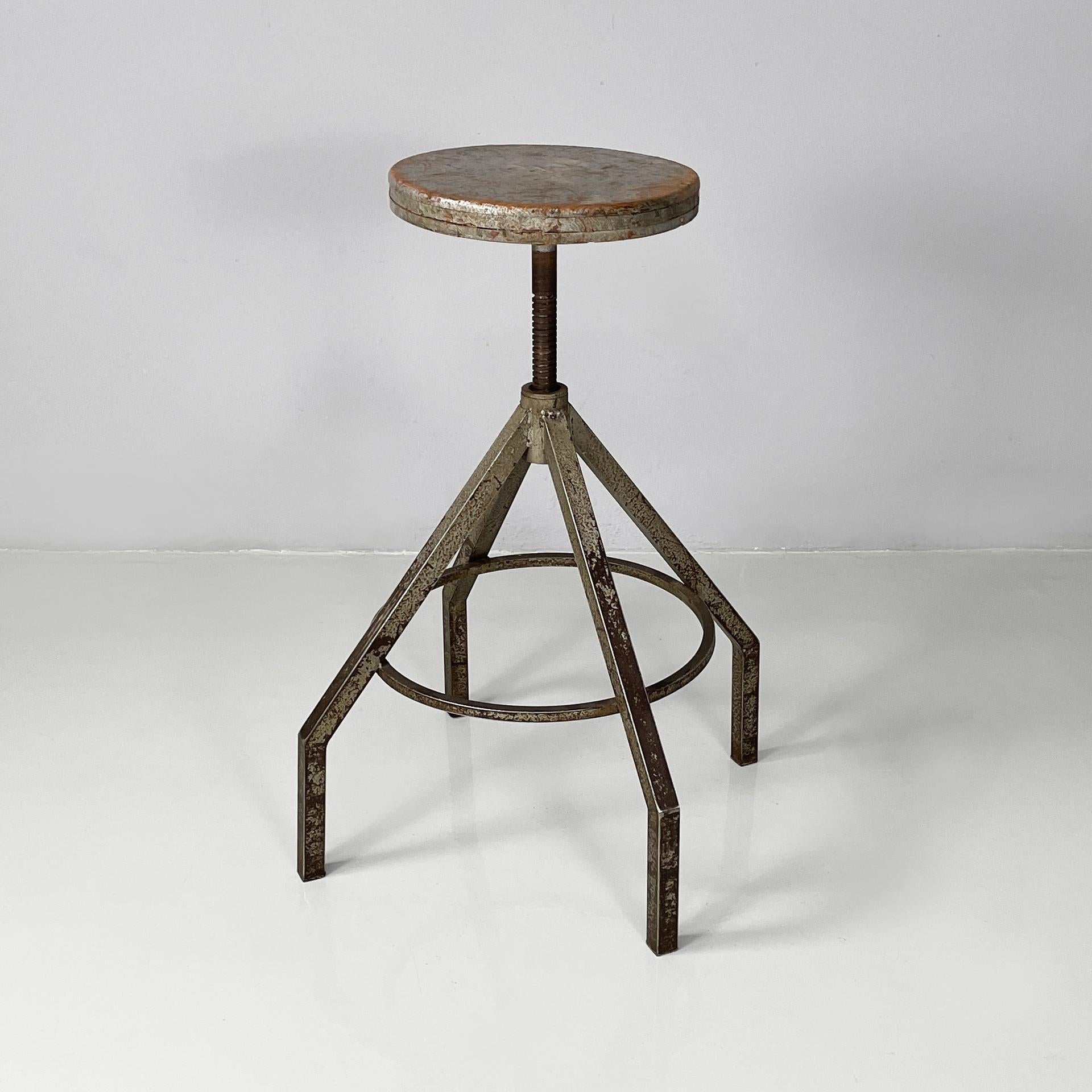 Italian industrial adjustable stool in grey wood and metal, 1950s
Stool with round seat in grey painted wood. The seat is adjustable in height. The square metal legs are joined by a metal rod, which can be used as a footrest.
1950s
Vintage