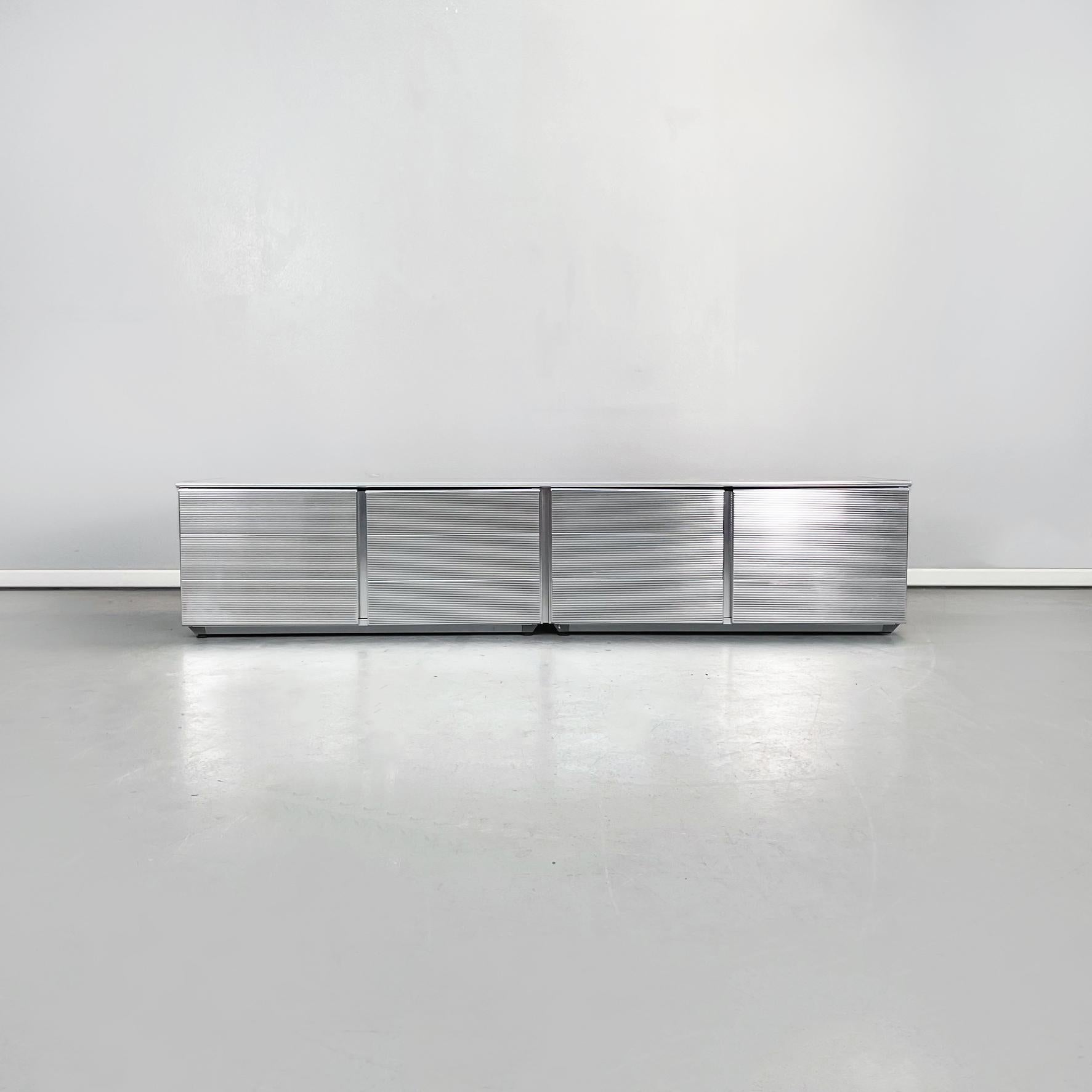 Italian Industrial Aluminium sideboard Velasca by Cozza and Mascheroni for Ycami, 1990s
Sideboard with rectangular base, in aluminium. The console has 4 compartments with internal top and hinged opening. The whole sideboard has a horizontally