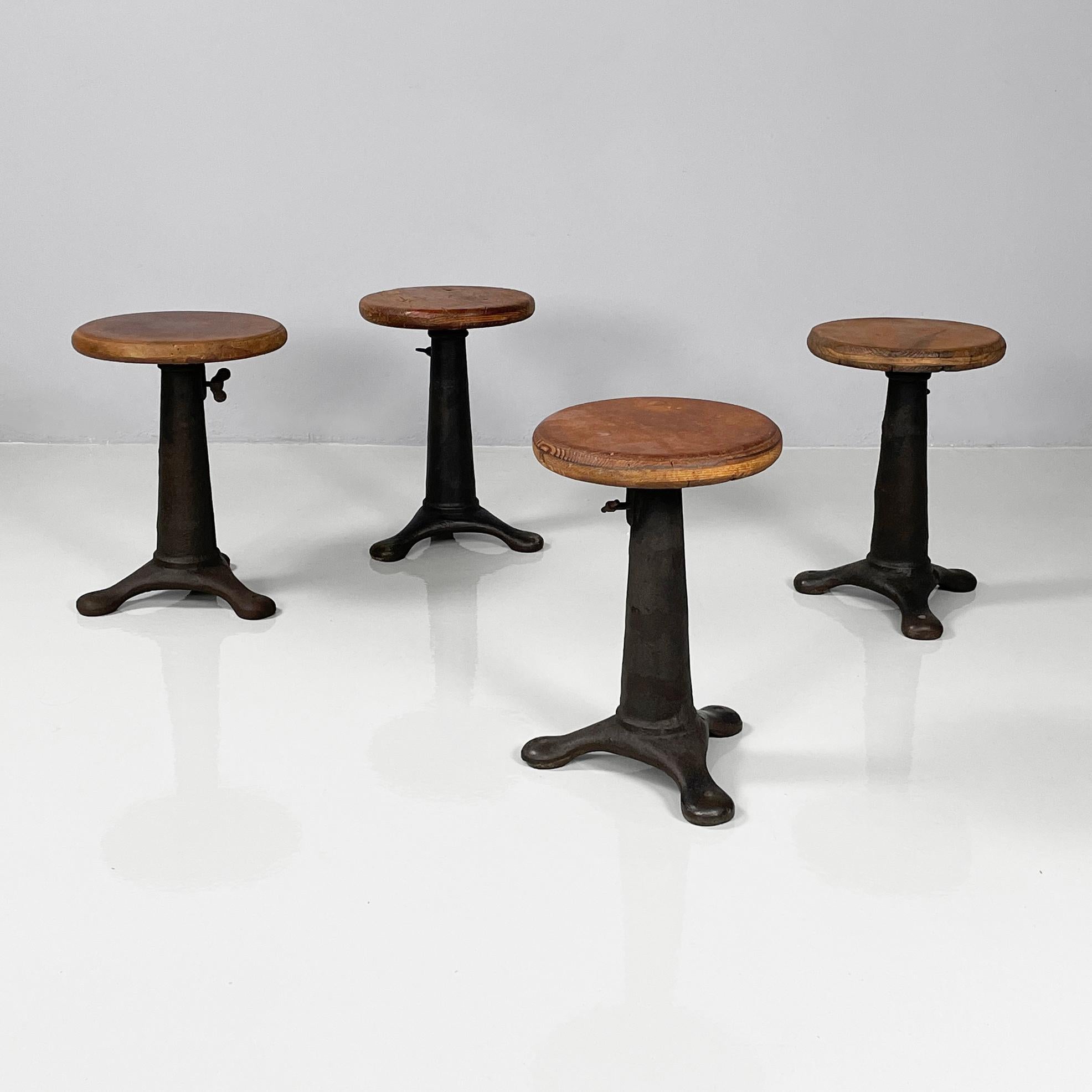 Italian industrial round stools in wood and cast iron, 1930s
Set of four stools with round wooden seat. The seat is adjustable in height. Cast iron conical base with three rounded legs.
1930s.
Vintage condition. The wood shows various signs of