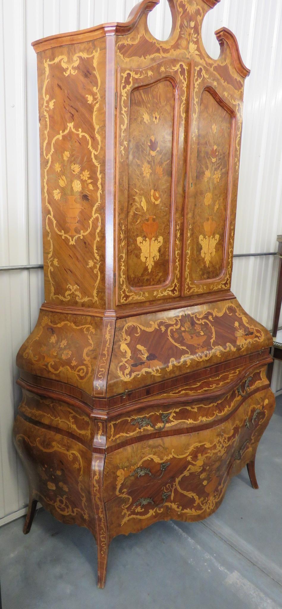 Italian inlaid Bombay secretary desk with 2 doors containing 2 shelves over drop desk containing 4 doors over three drawers.