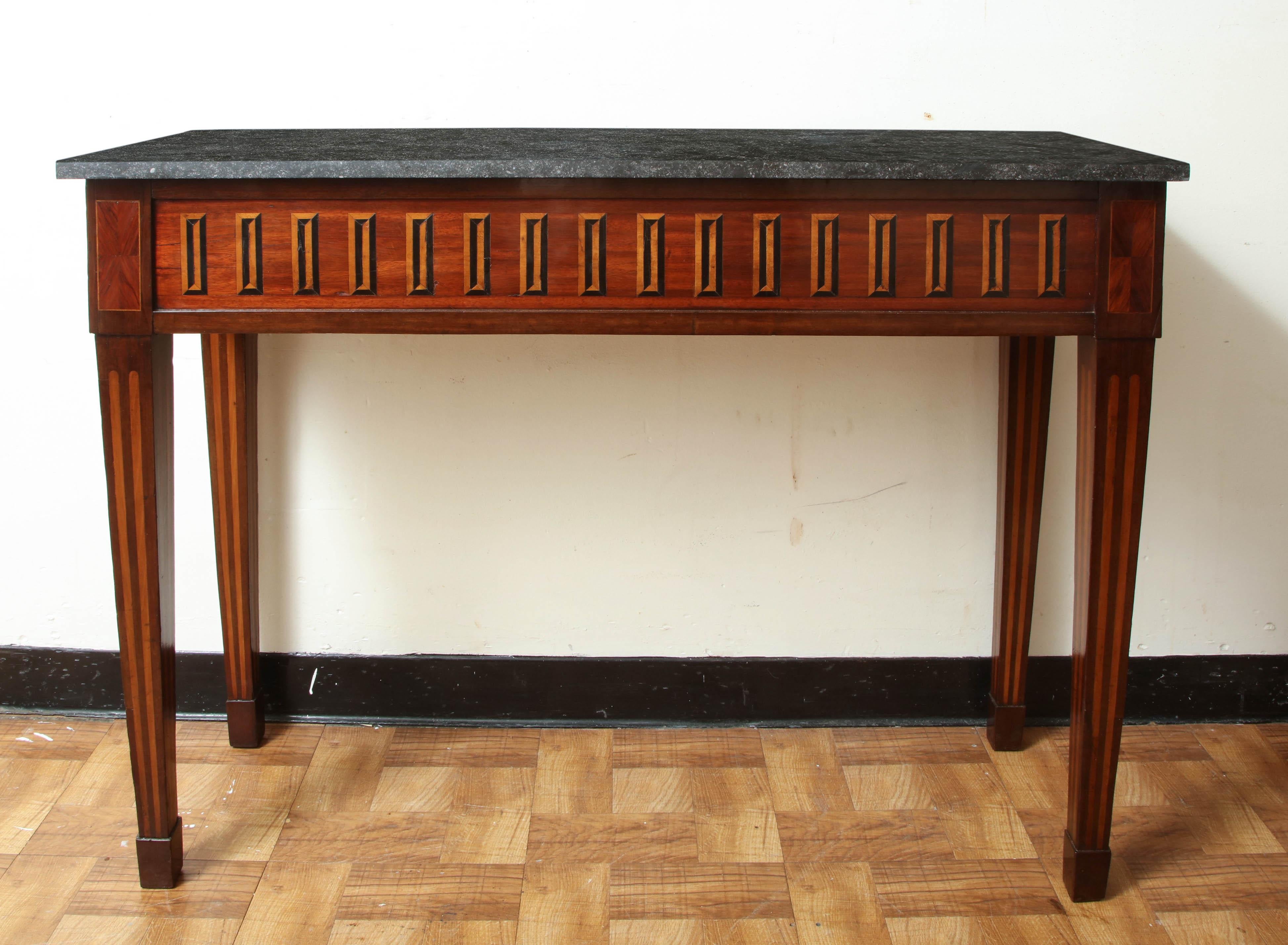 Early 19th century console table with inlaid apron of ebony and rosewood with tapering legs and Belgian Bluestone top. Italy, circa 1810.



Available to see in our NYC Showroom 
BK Antiques
306 East 61st St. 2nd fl.
New York, NY 10065