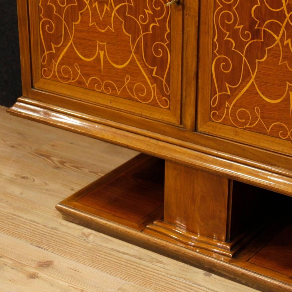 Italian sideboard from the mid-20th century. Furniture of exceptional quality, richly inlaid on the doors, in walnut, mahogany and maple wood. Five-doors sideboard, complete with working keys, of excellent capacity and service. Central door equipped