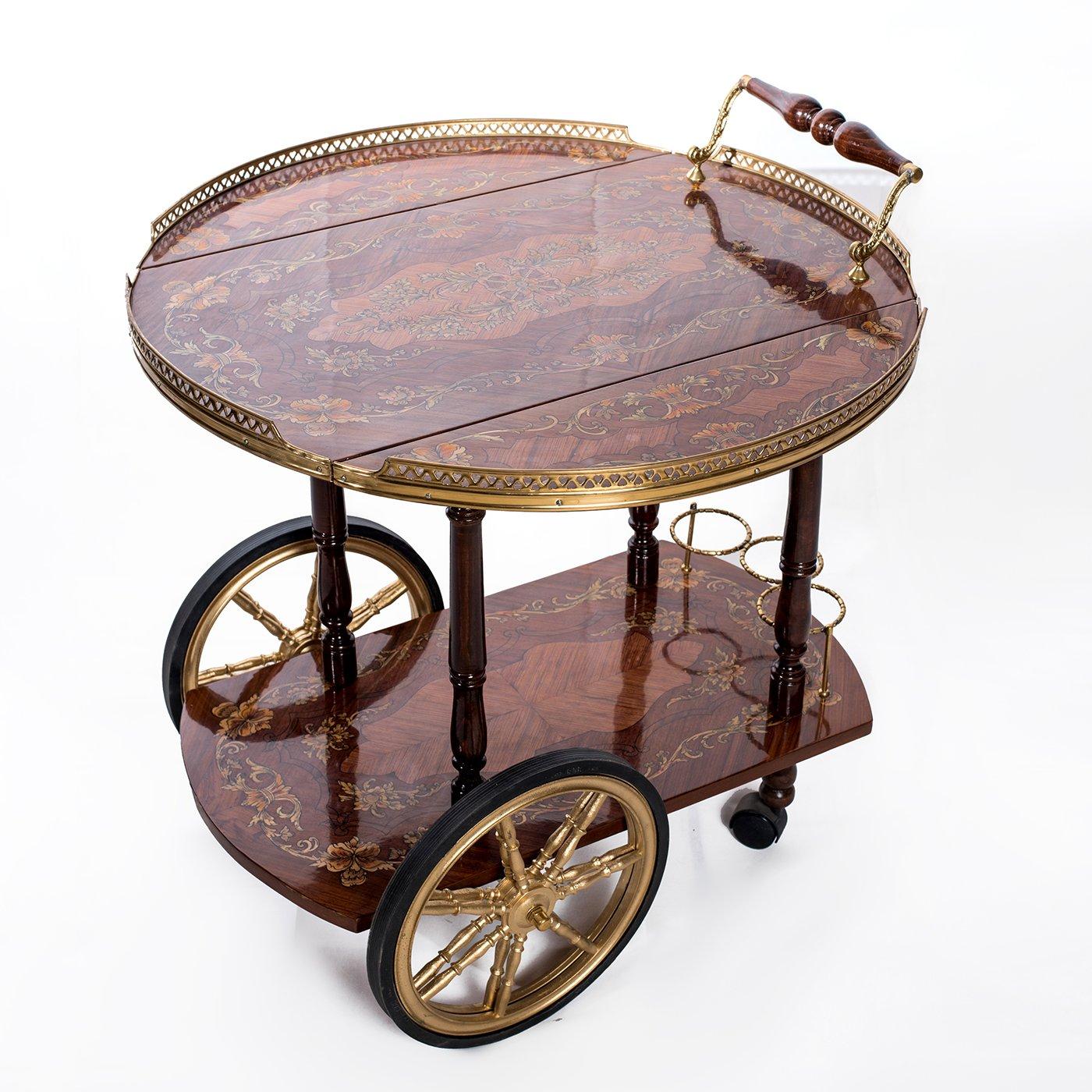 A beautiful Italian inlaid tea cart 19th century style, 20th century. 

Exquisite handmade Italian inlaid tea cart covered with natural veneer and decorated both tiers with Marqueterie floral and leaf designs, in addition to brass bottle holders,