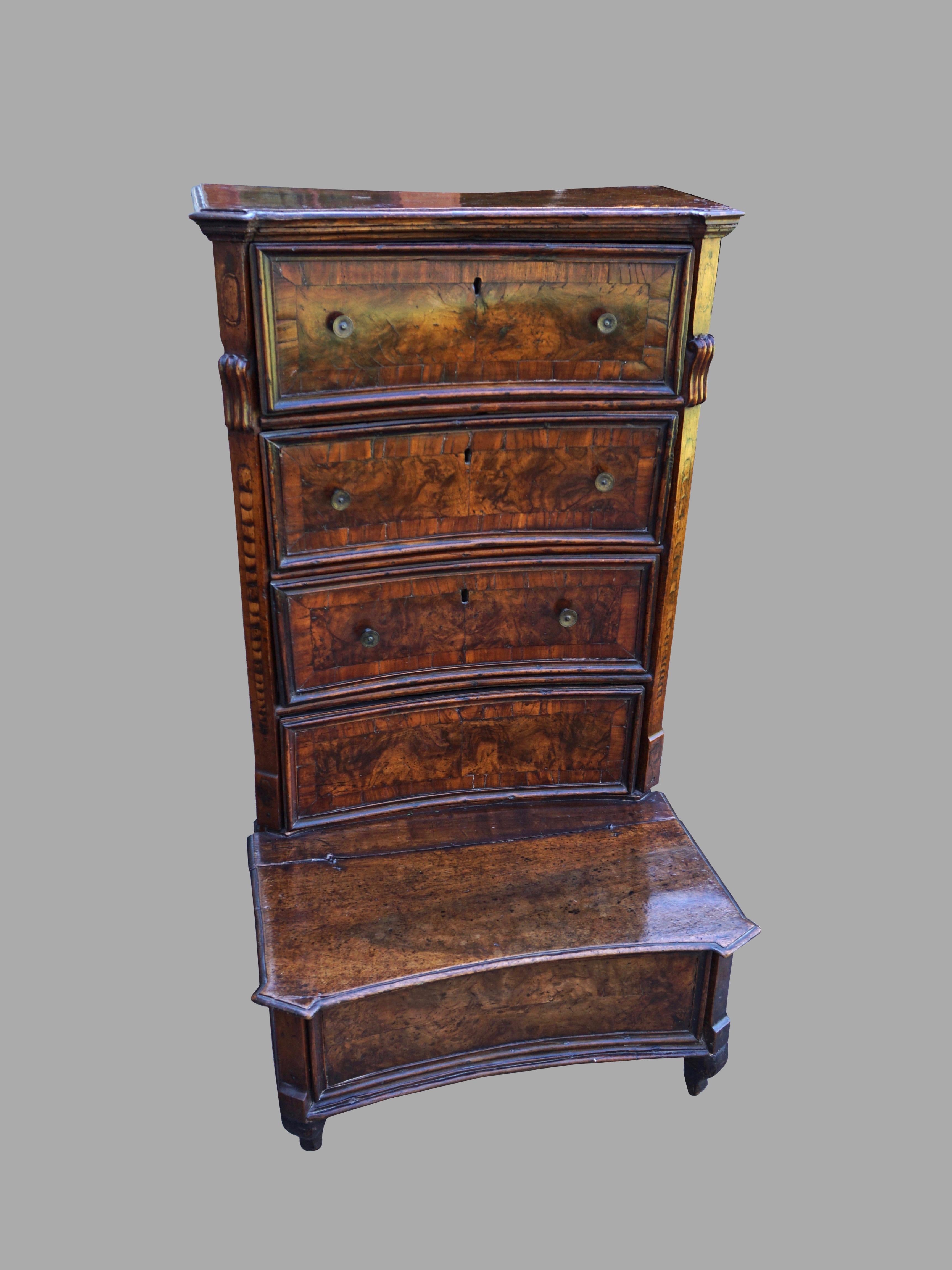 A fine quality Italian 17th century inlaid and burled walnut prie-dieu with a lovely warm color, the concave form upper stage with inlaid quarter columns topped by scrolls framing 3 functional cross-banded drawers and one additional dummy drawer,