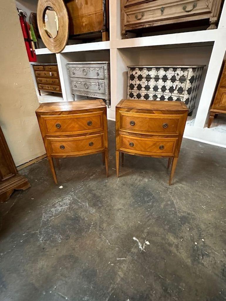 Handsome pair of antique Italian inlaid walnut shaped front side tables. Circa 1900. Adds warmth and charm to any room!