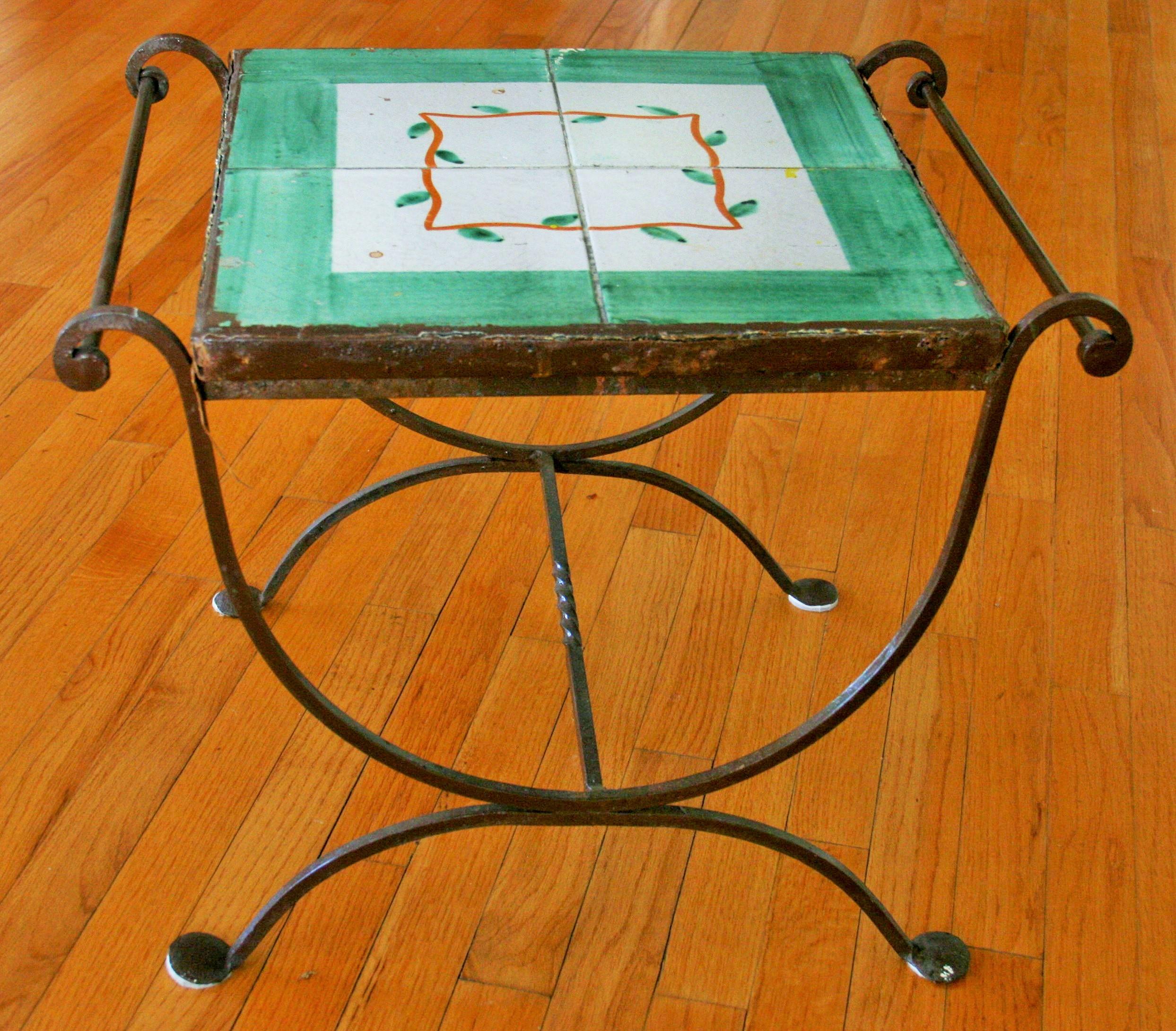 8-105 Italian handmade iron table with hand painted ceramic tiles.