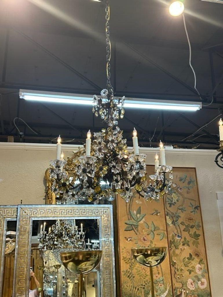 Early 20th century Italian iron and crystal flower chandelier. Circa 1920. The chandelier has been professionally rewired, comes with matching chain and canopy. It is ready to hang!