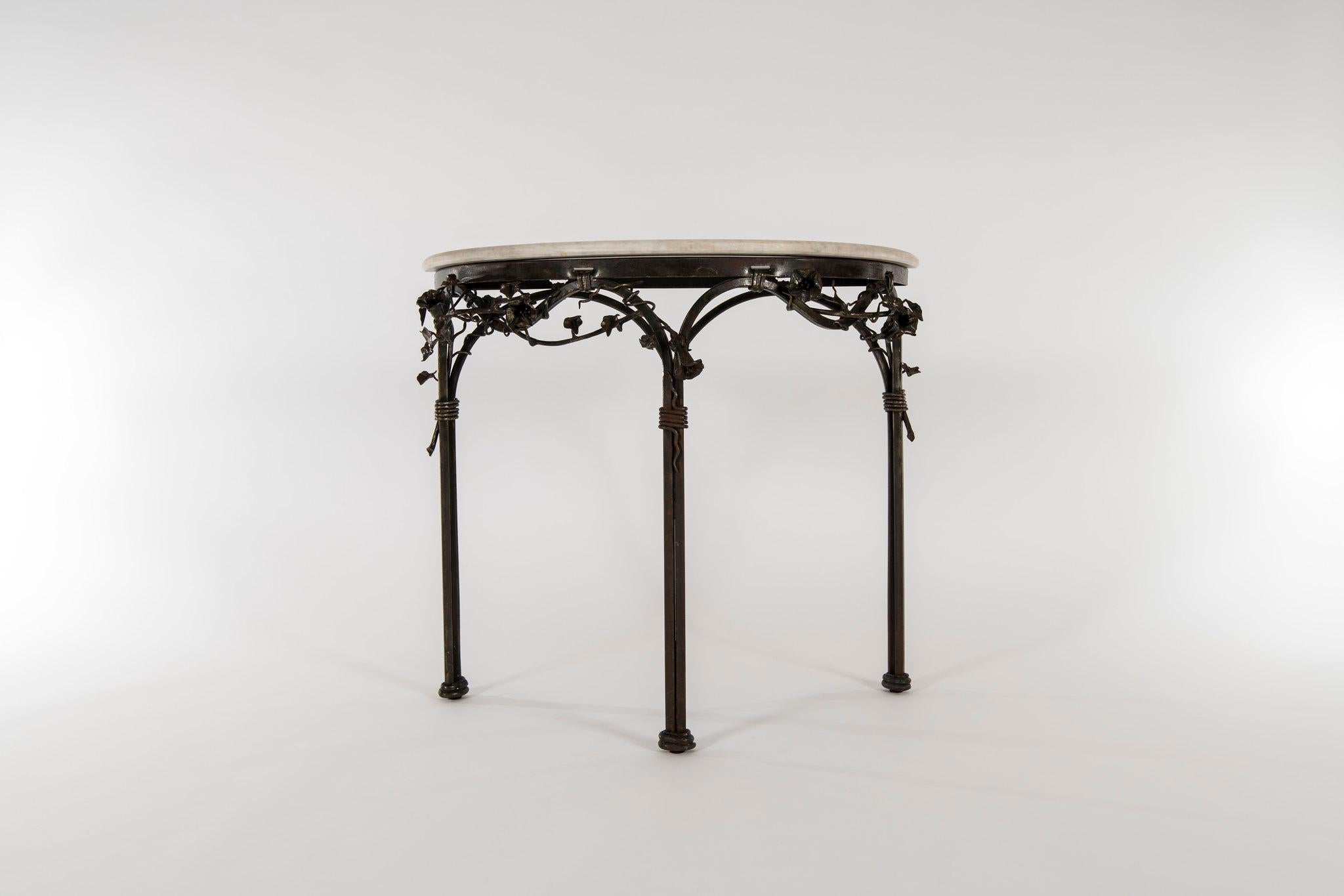 1960s Italian wrought iron demi console with white marble top.


Marble-top dimensions: 37.5