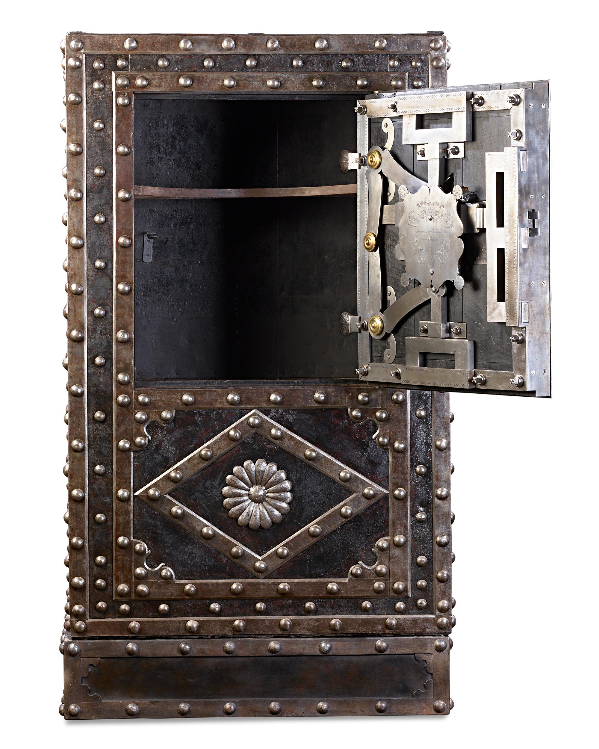 Massive in size and constructed to be impenetrable, this fully functioning Italian safe was crafted by the Italian safe and strongbox manufacturer Francesco Barbaglia of Milan. The entire structure is enfolded with thick sheets of iron and features