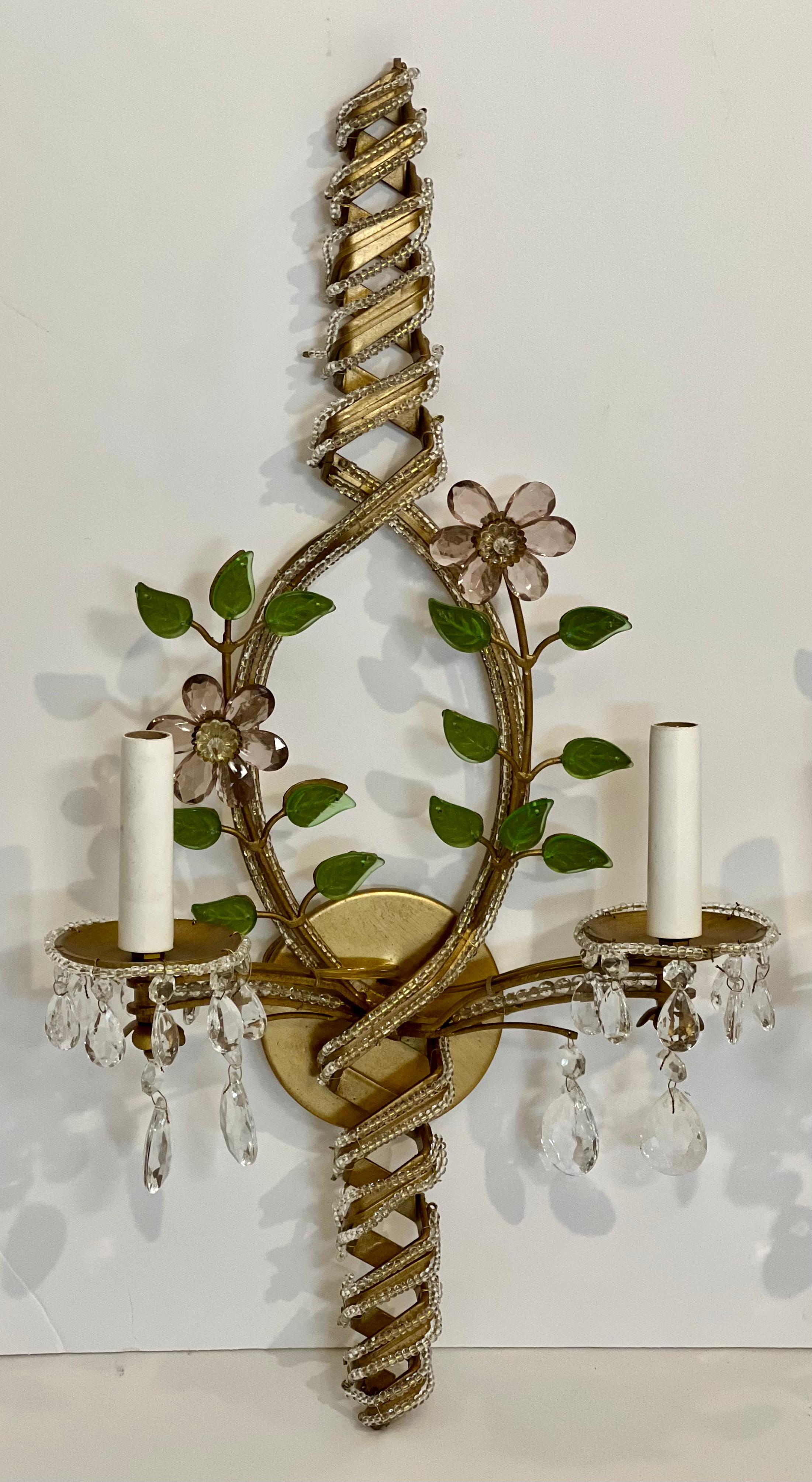 Elegant Italian iron sconces with intricate crystal flowers and beading.

These gorgeous sconces have lovely color with amethyst flowers and green leaves with faceted teardrop crystals and beading . Condition is new but made in early 2000s as they