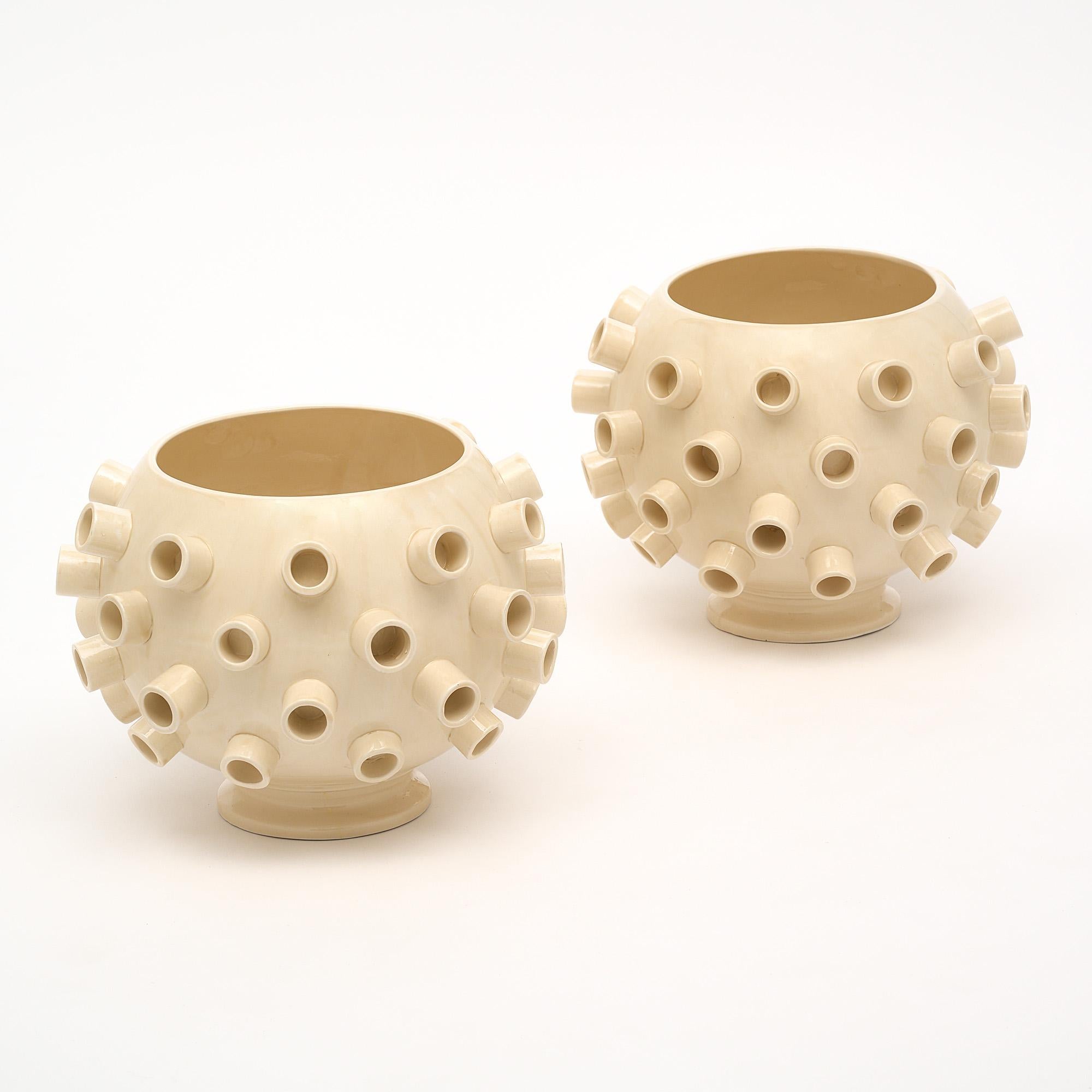 Pair of vases, in the Brutalist style, from Verona, Italy. This pair is made of white ceramic with a glossy glaze. They are signed MC for artist M. Costa.