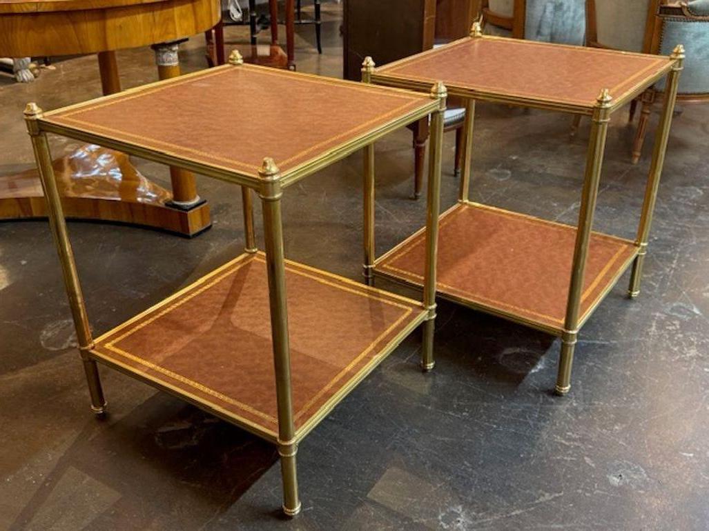 Pair of Italian Jansen Manner brass and leather side tables. Italian Jansen manner side tables are elegant mid‑20th century designs inspired by Maison Jansen, blending neoclassical revival with Hollywood Regency flair. They often feature brass,