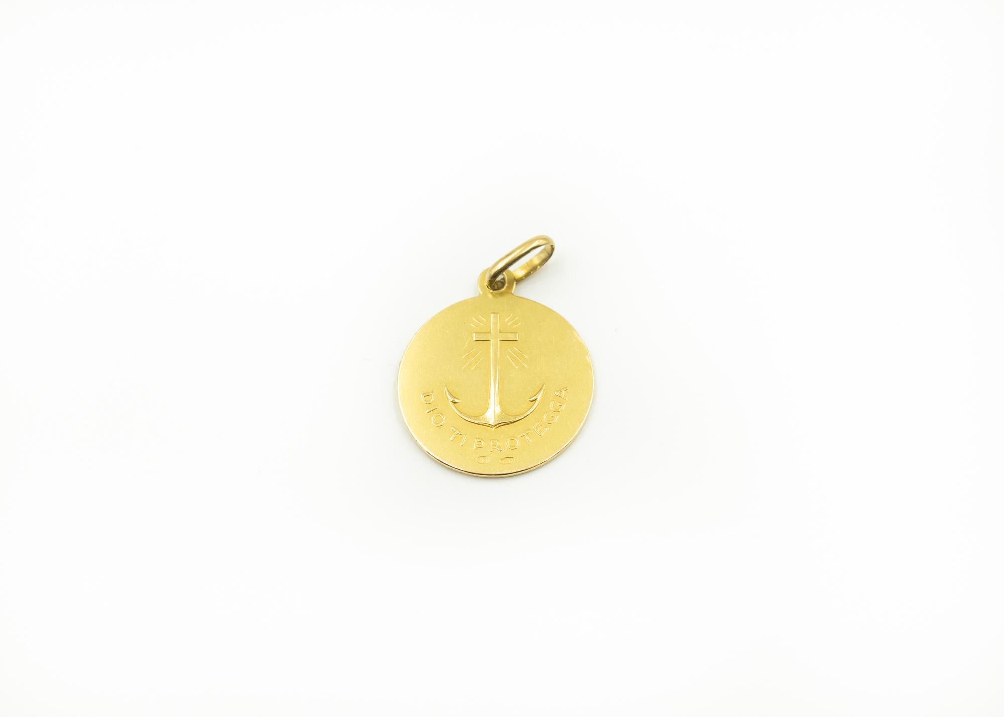 Beautiful, vintage Italian 18K gold Jesus pendant/charm. Front has a raised profile of Jesus with a cross behind him. The back reads: Dio Ti Protegga and has a raised cross/anchor.
Depth below is the medal.  Depth on bale is .18