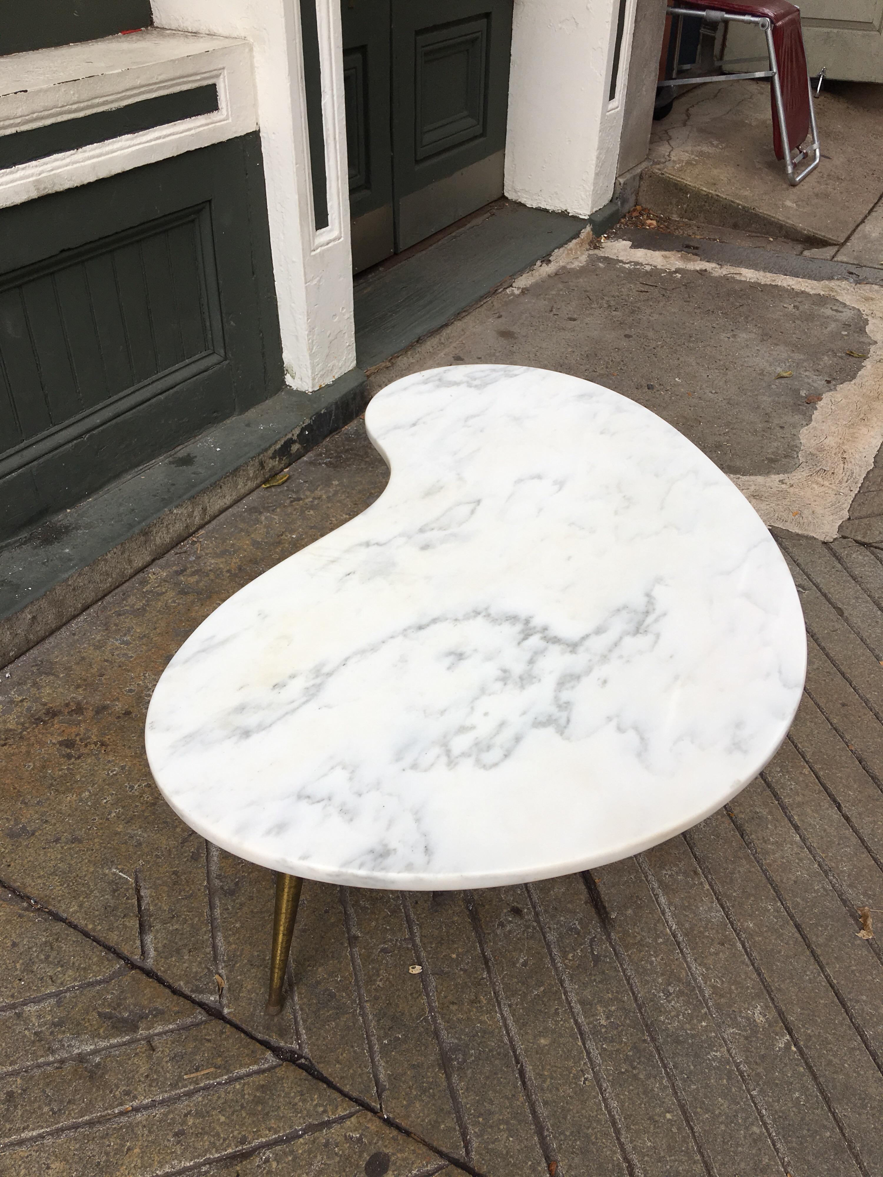 white kidney shaped coffee table