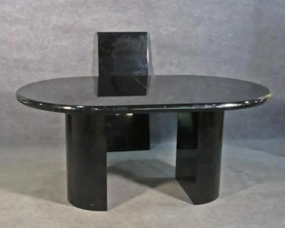 Vintage modern ebonized lacquered dining table by Pietro Costantini. Featuring one leaf extending the table to 94