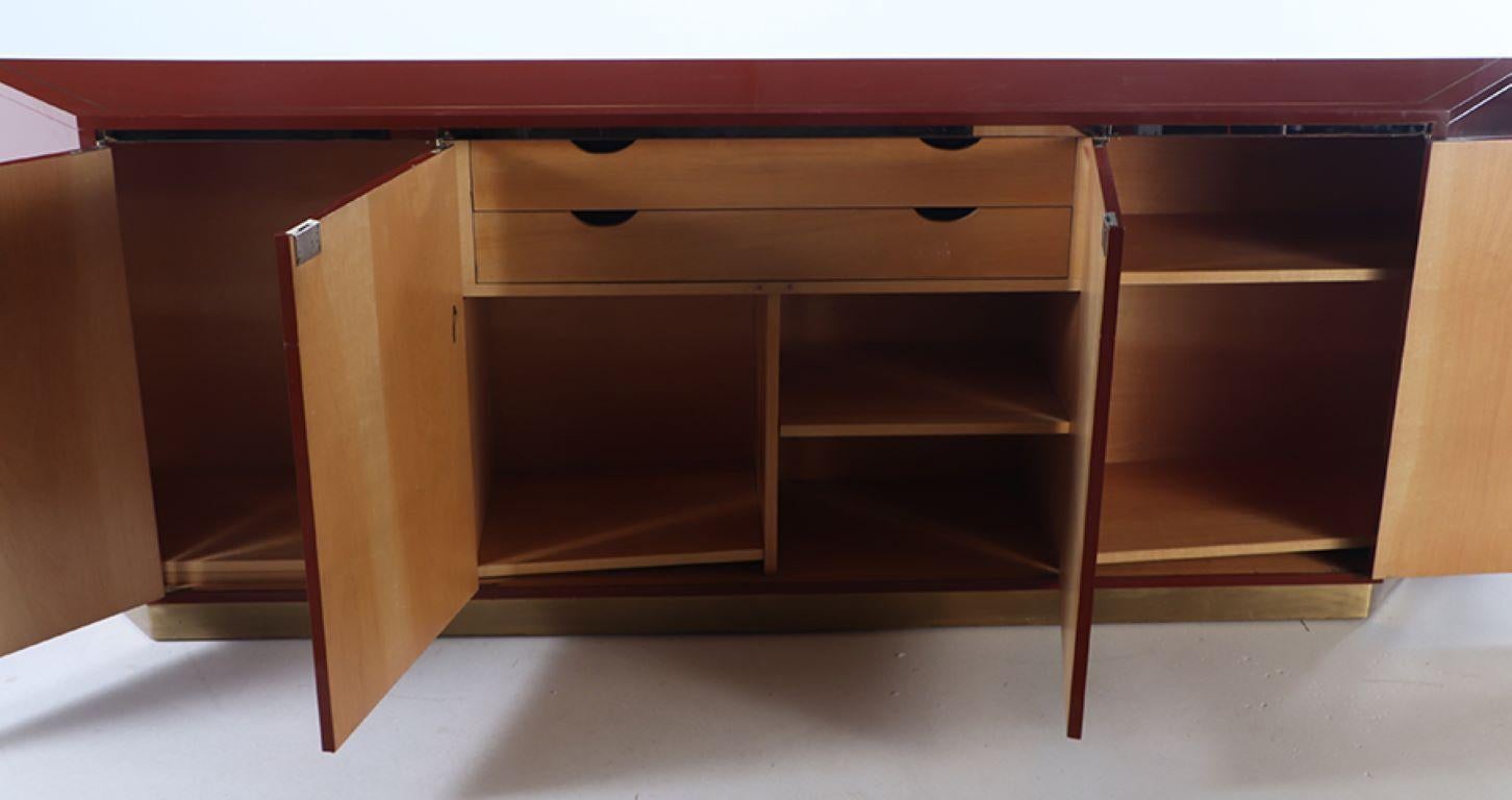 Lacquered Italian lacquered, four door sideboard with brass trim attributed to Willy Rizzo