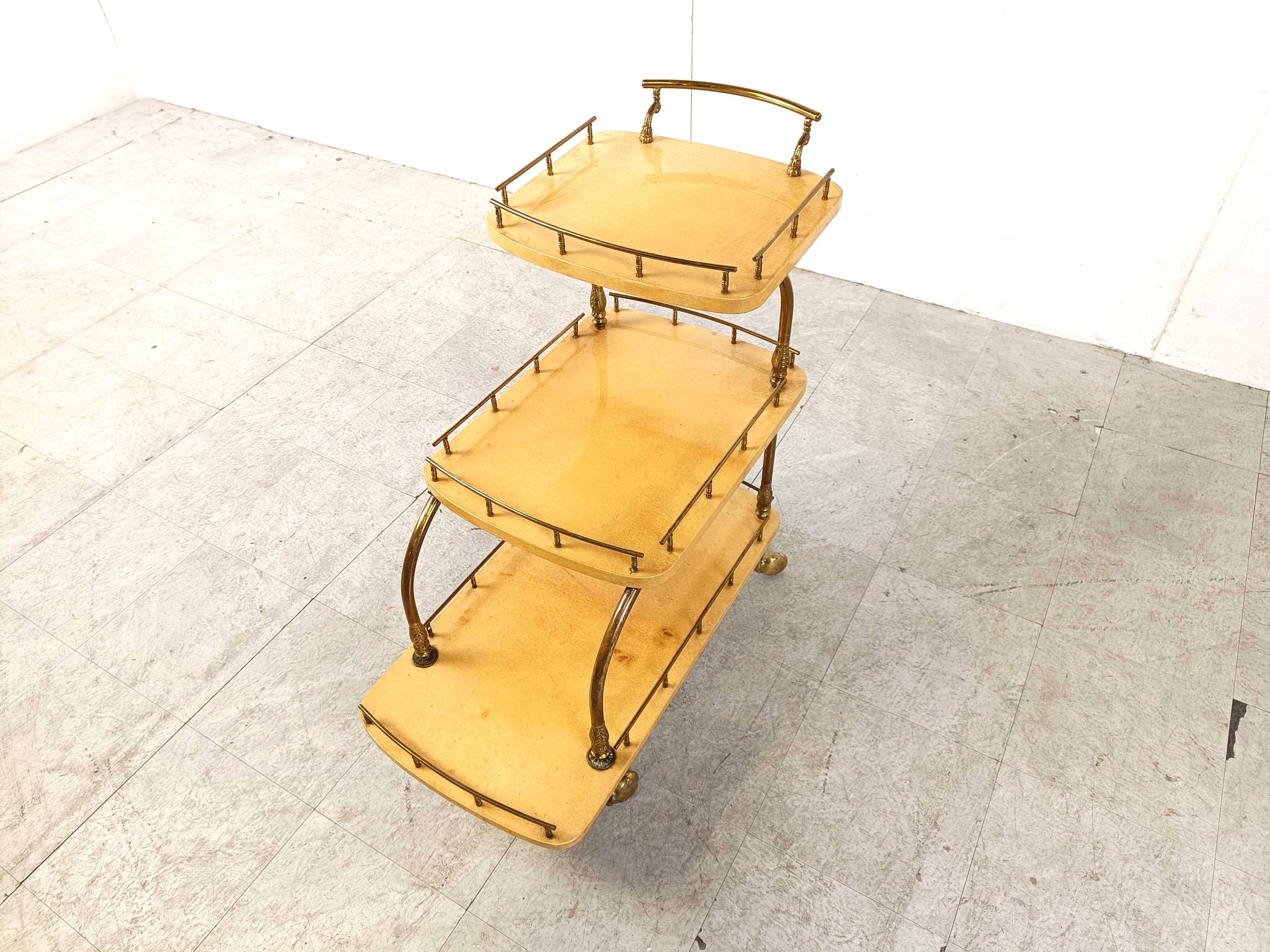 Very unique Aldo Tura Goatskin or parchment bar cart. This bar cart was made in Italy in the 1960s. 

Constructed of thickly lacquered goatskin / parchment and gilt metal hardware. 

Perfect bar or serving cart, or as rolling storage in an