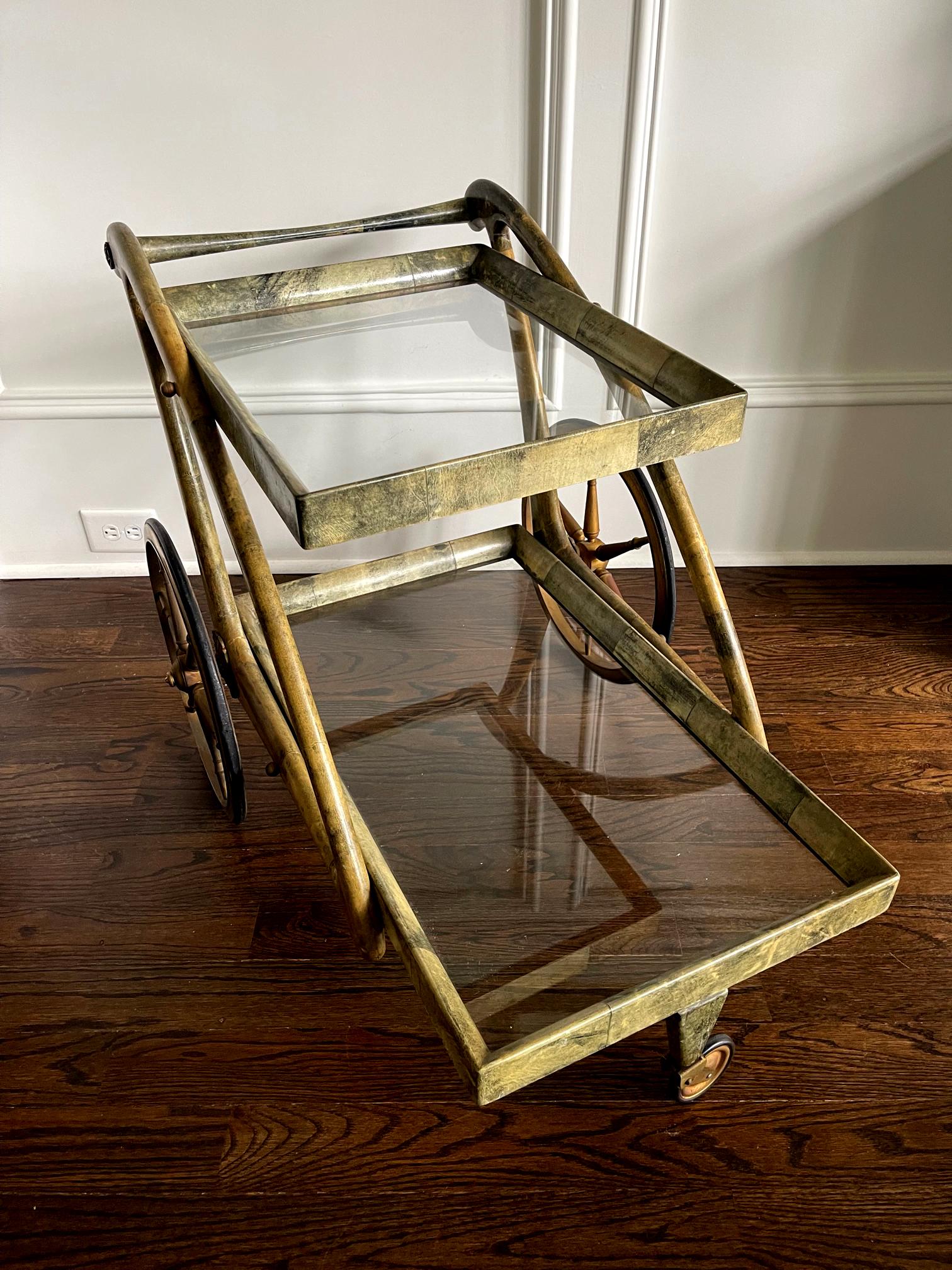 A beautiful and functional service bar cart by Italian designer Aldo Tura (1909-1963) circa 1950-60s. The glamorous design embodies the jetsetter's lifestyle of the mid-20th century when the luxury lies in the exotic material and craftmanship. The