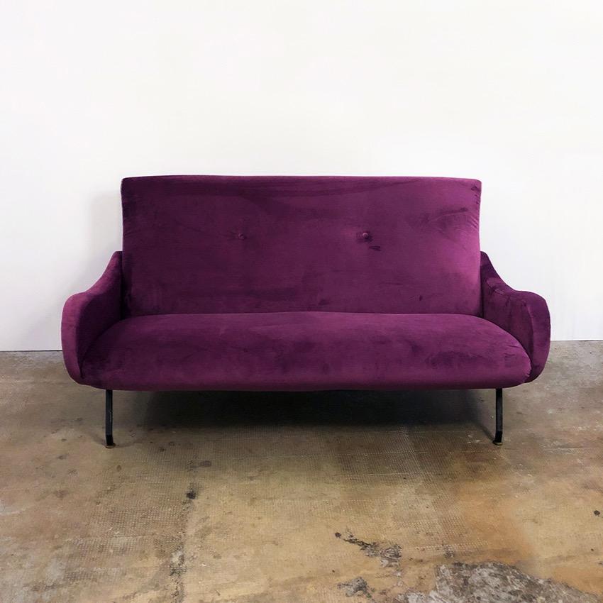 Italian Lady style aubergine purple velvet sofa, 1950s. The sofa, with curved arms and black metal legs, is completely restored and furbished with a purple velvet fabric. Very good conditions.