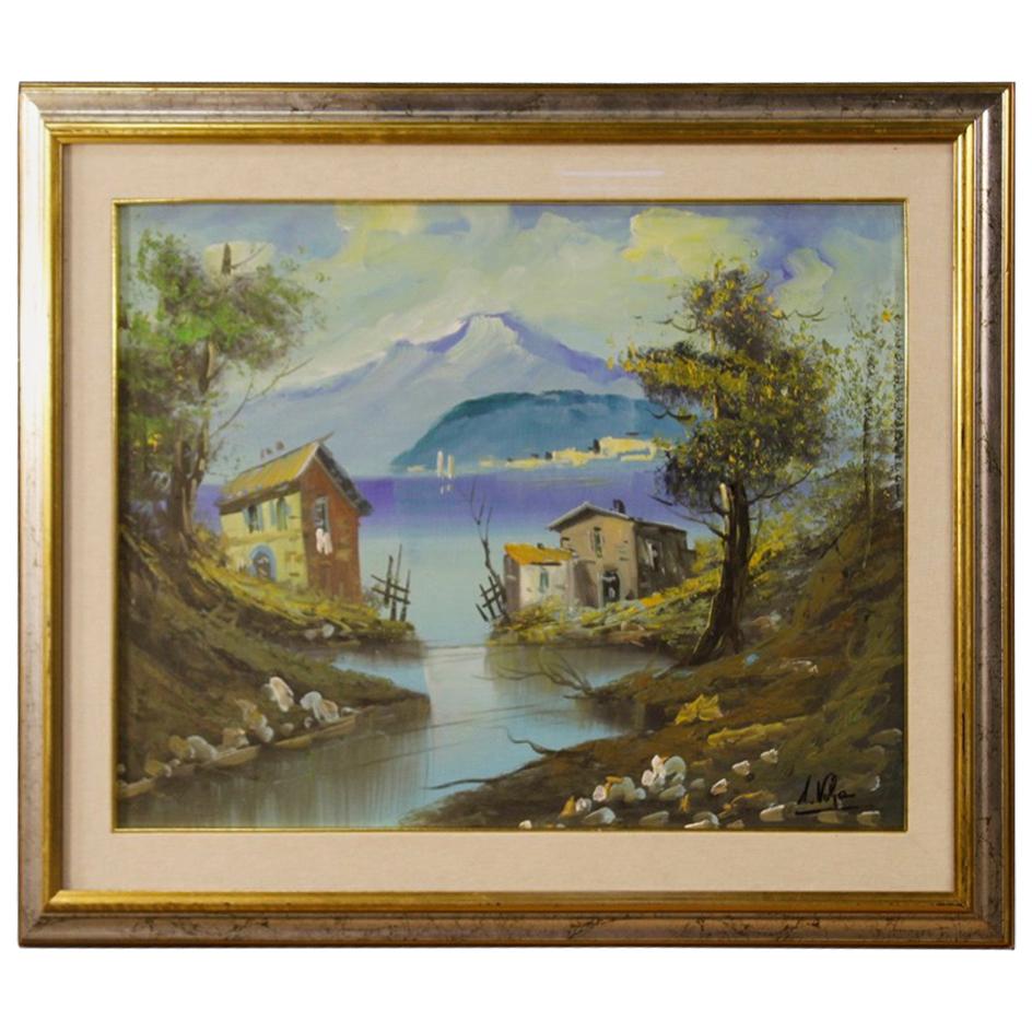 Oil painting on canvas from 20th century. Italian painting signed lower right. Picture depicting a lake view of a good pictorial quality. Silvered and gilded wooden frame with fabric passepartout in good condition. Painting complete with protective