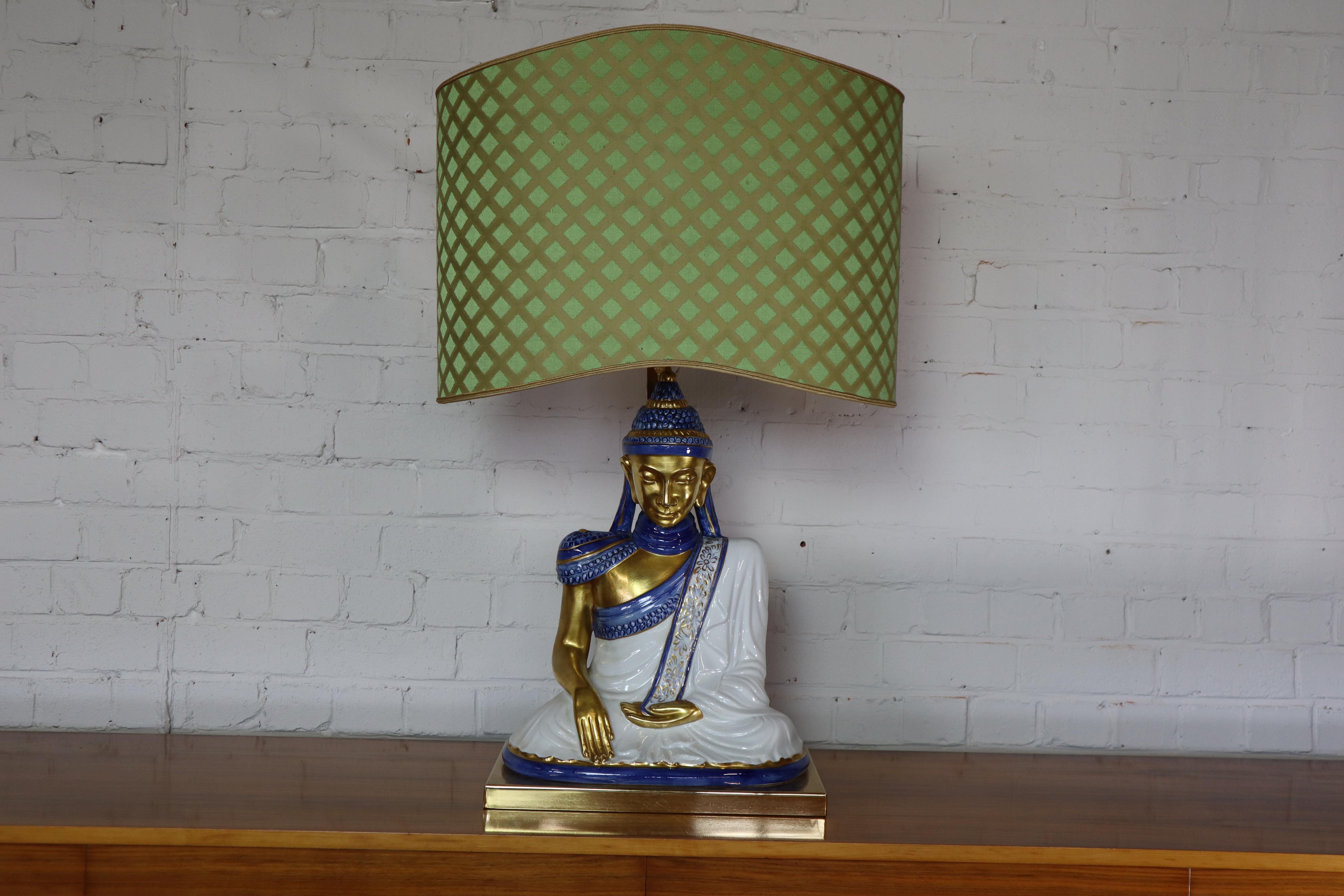 Italian lamp by Societa Porcellane Artistiche Firenze, 1970's.
Hand painted porcelain Buddha on a brass frame base. Original labeled lampshade covered with silk.
Lampshade height adjustable
Dxhxw: 25x86x53 cm