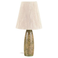 Italian lamp manufacturer. Tall and slender table lamp in alabaster.