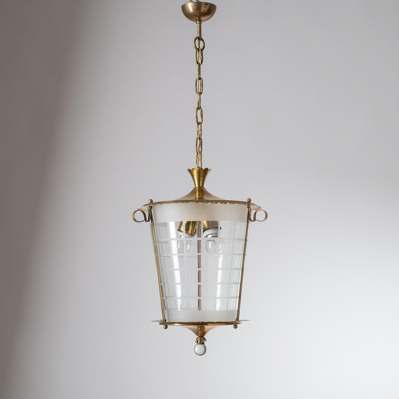 Fine Italian brass and glass lantern from the 1930s. Two original brass and ceramic E27 sockets with new wiring. Height without the chain is approximately 17inches/43cm.