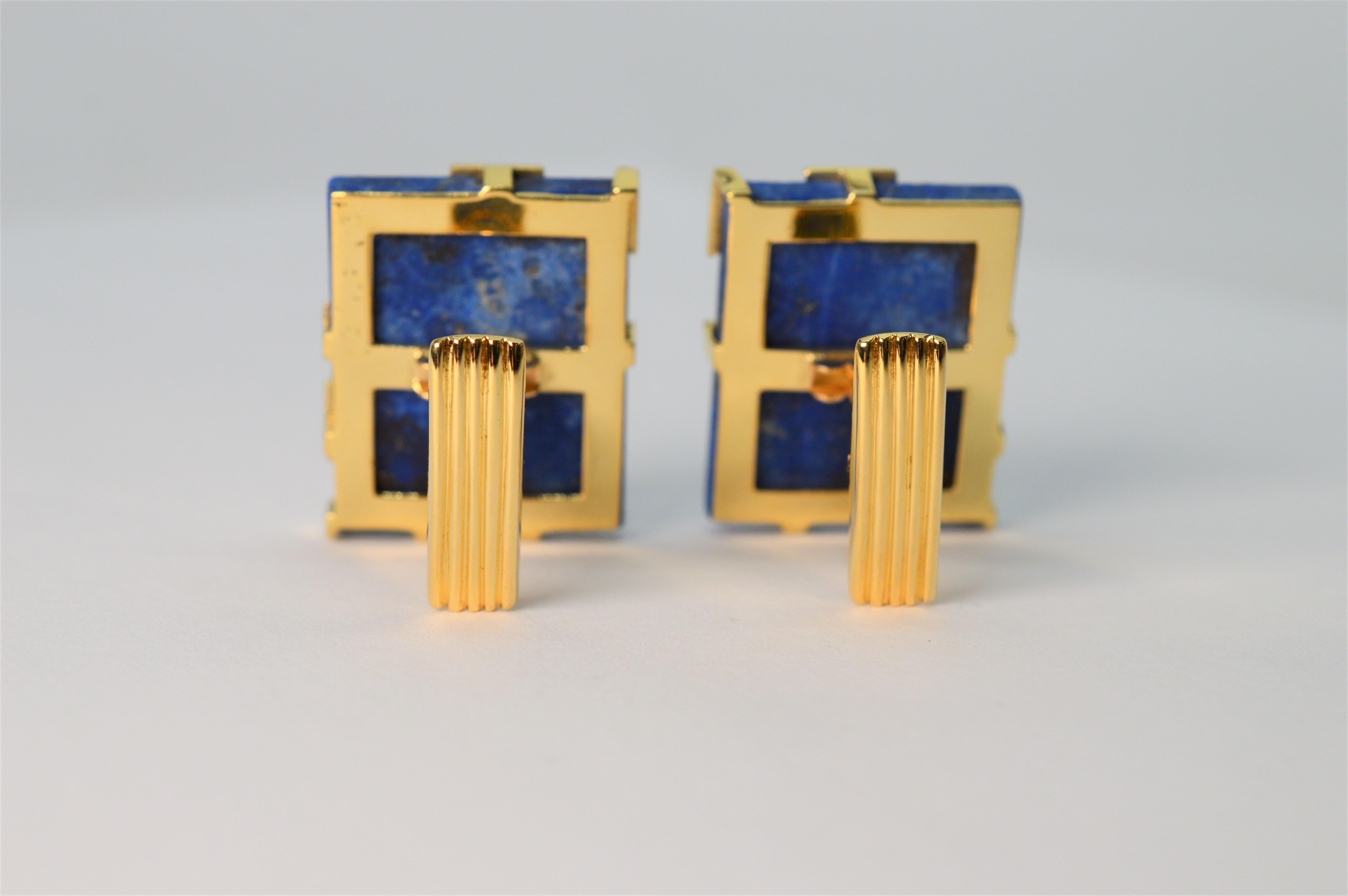 Vivid blue lapis lazuli stone tiles accented with eighteen 18k yellow gold create this modernist pair of unisex cufflinks. With an artful circular pattern, gold partially overlays the blue stone letting the blue color and natural  beauty of the