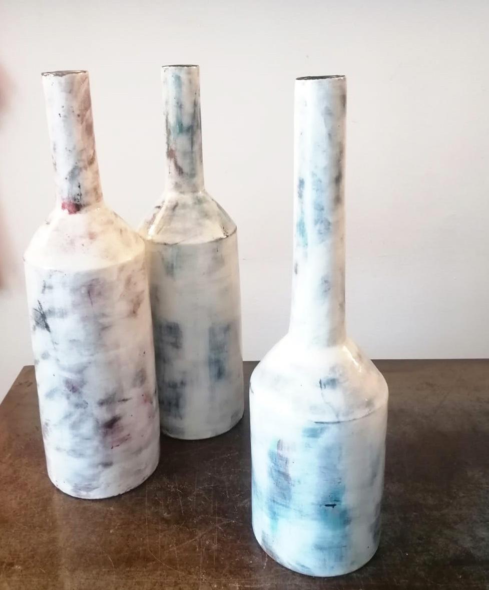 Beautiful set of three large vase designed and handmade by Marco Fusco in Minori.
In glazed ceramic.
Evident inspiration from the subject of Giorgio Morandi's Still Life.

 