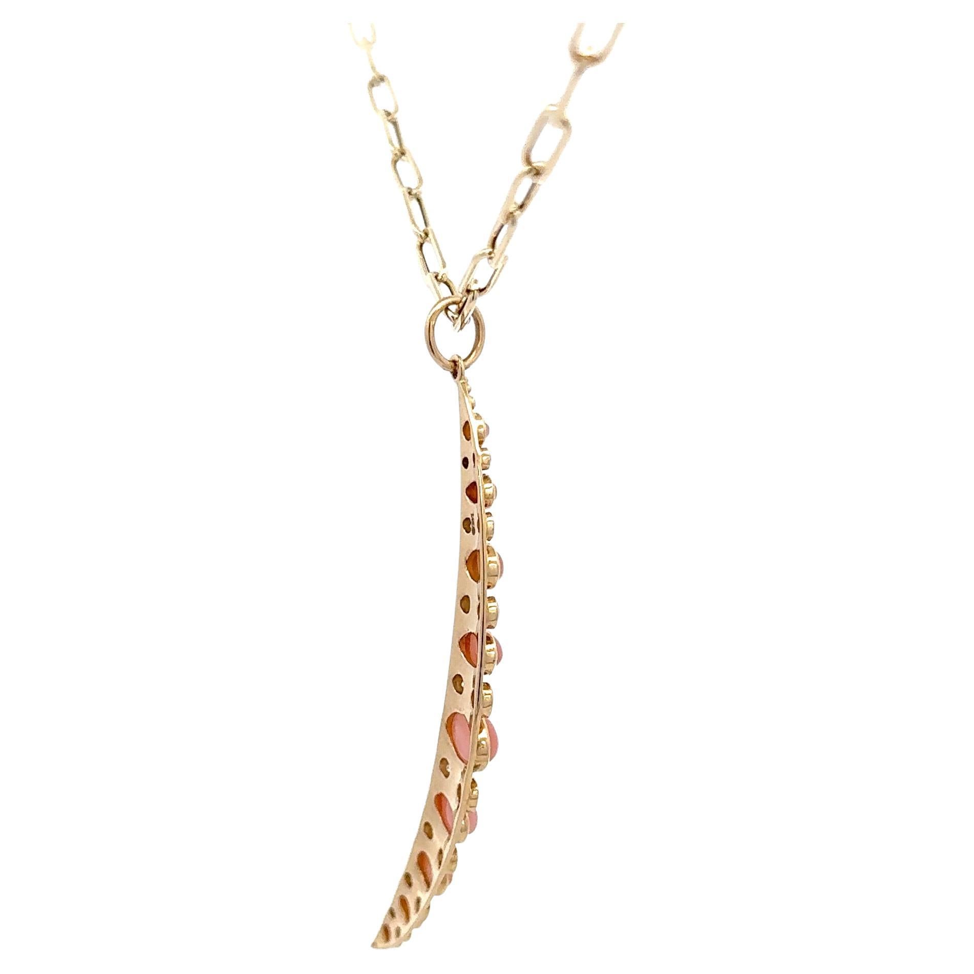 Italian made, this 14 karat yellow gold pendant features a large moon with Coral and round brilliants on a mini paperclip chain, 18 inches. 
Moon 2.25 inches
Pendant & chain can be sold separately
Please DM for more info.

 