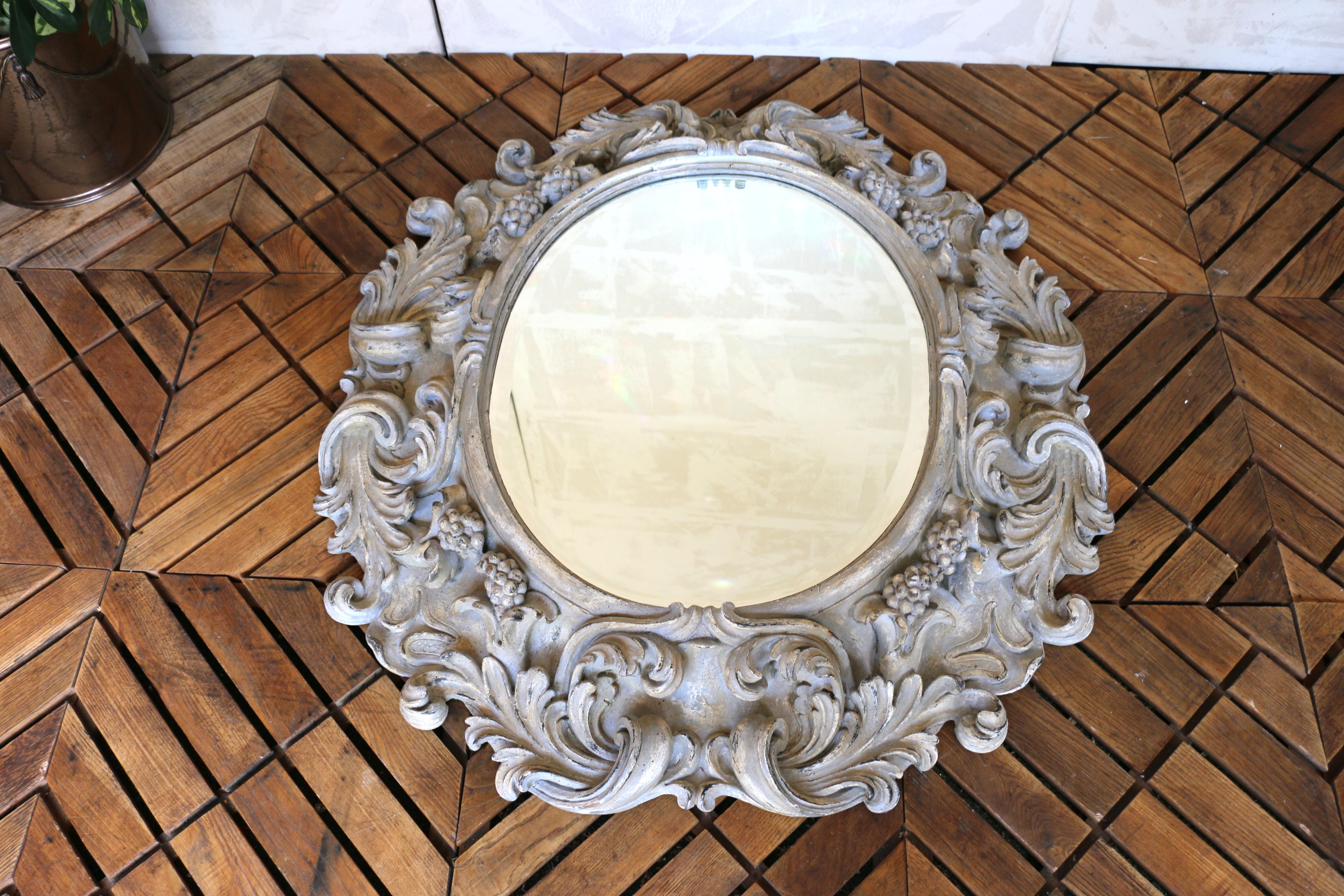 Late 20th Century Italian Large Deeply Carved Wooden Oval Mirror With Beveled Glass, Circa 1980s For Sale