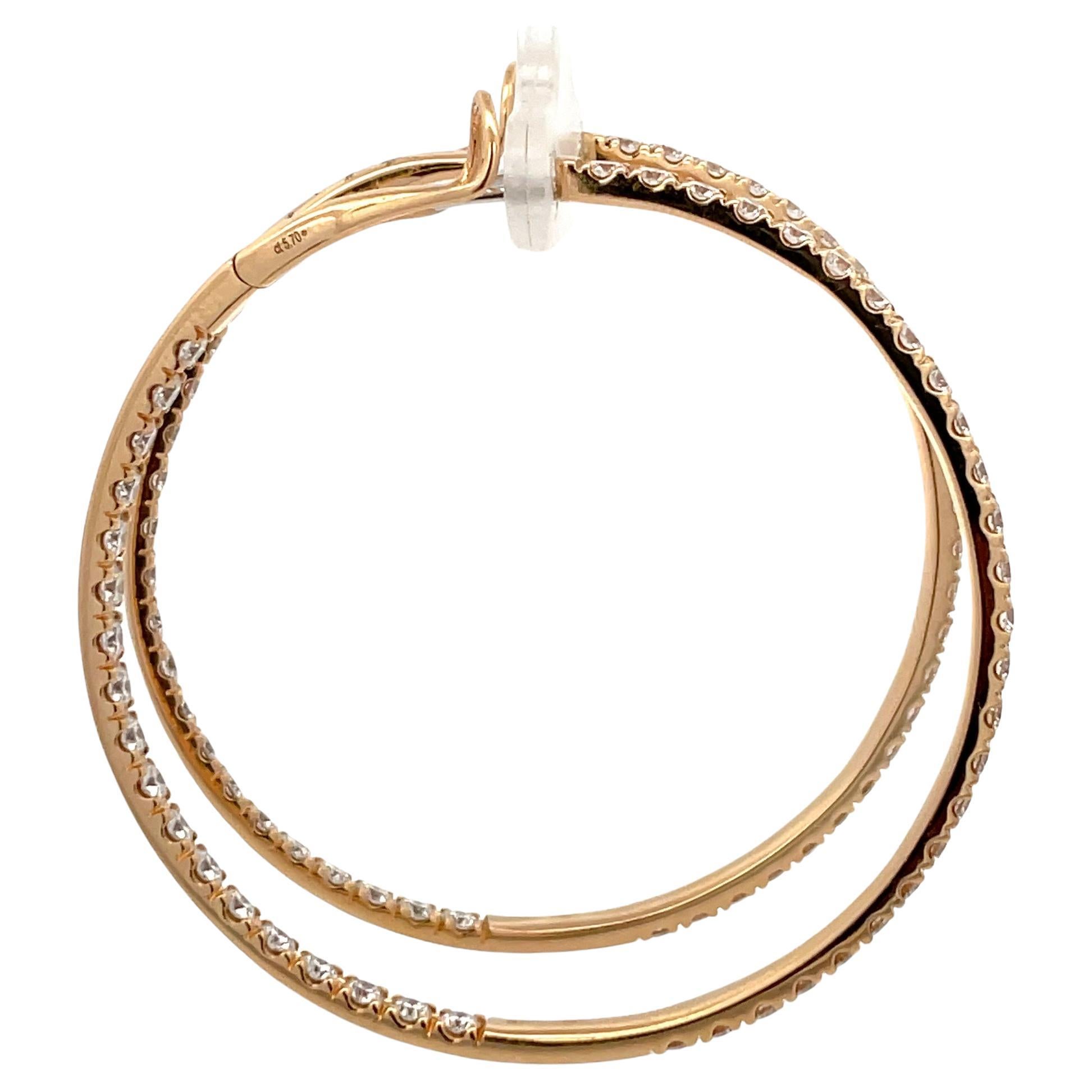Italian, large hoop earrings featuring 88 round brilliants weighing 5.70 carats.
Color F
Clarity VS

Post is set to the side so they show face up and not to the side. 
Designer: Crivelli Jewelry 