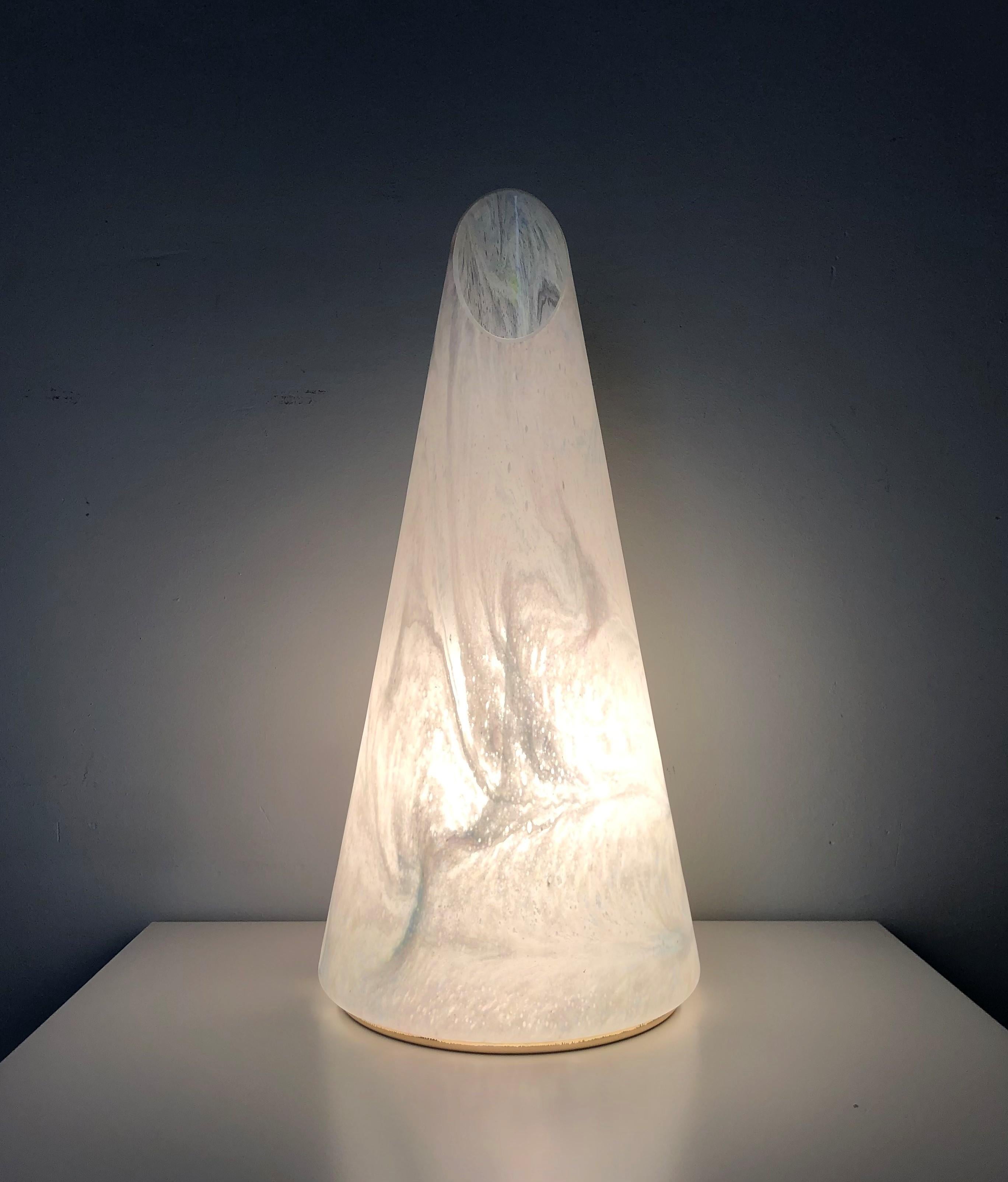 Large and beautiful murano cone shape table lamp. This fixture was made during the 1980s in Italy.
This lamp is equipped with one light socket (E27). A professional electrician has checked and prepared the piece to operate in US, UK and EU.
Our