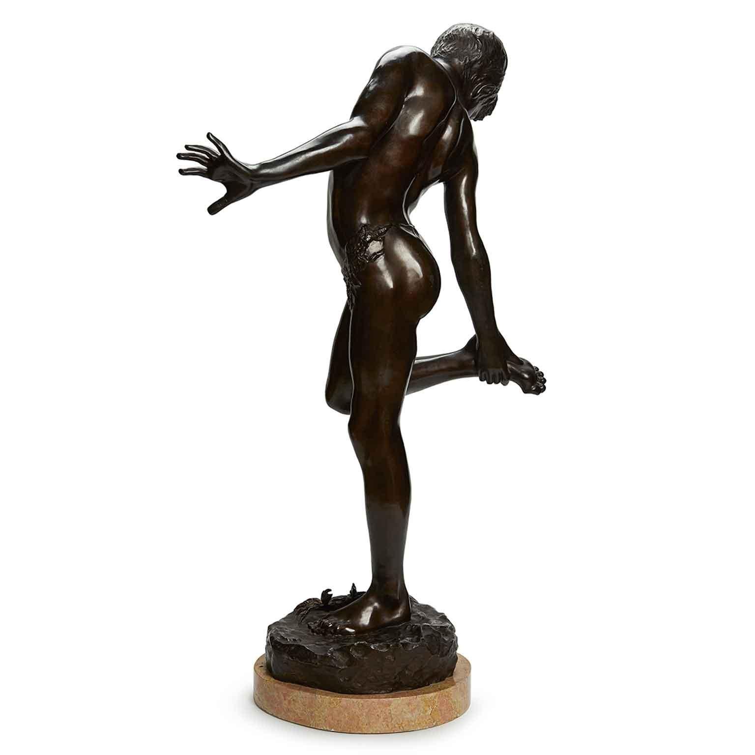 Annibale De Lotto Italian bronze fisher boy Sculpture featuring a semi nude young boy figure, a standing fisher boy getting bit by a crab on his foot holding up his right leg, observing the crab bite. 
Realized in the early 20th century, thisl large