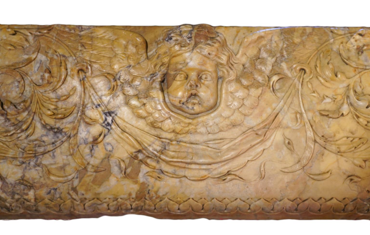 Hand-Carved Italian Late 18th Century Sienna Mantel Console Carved with Putti and Leaf Work