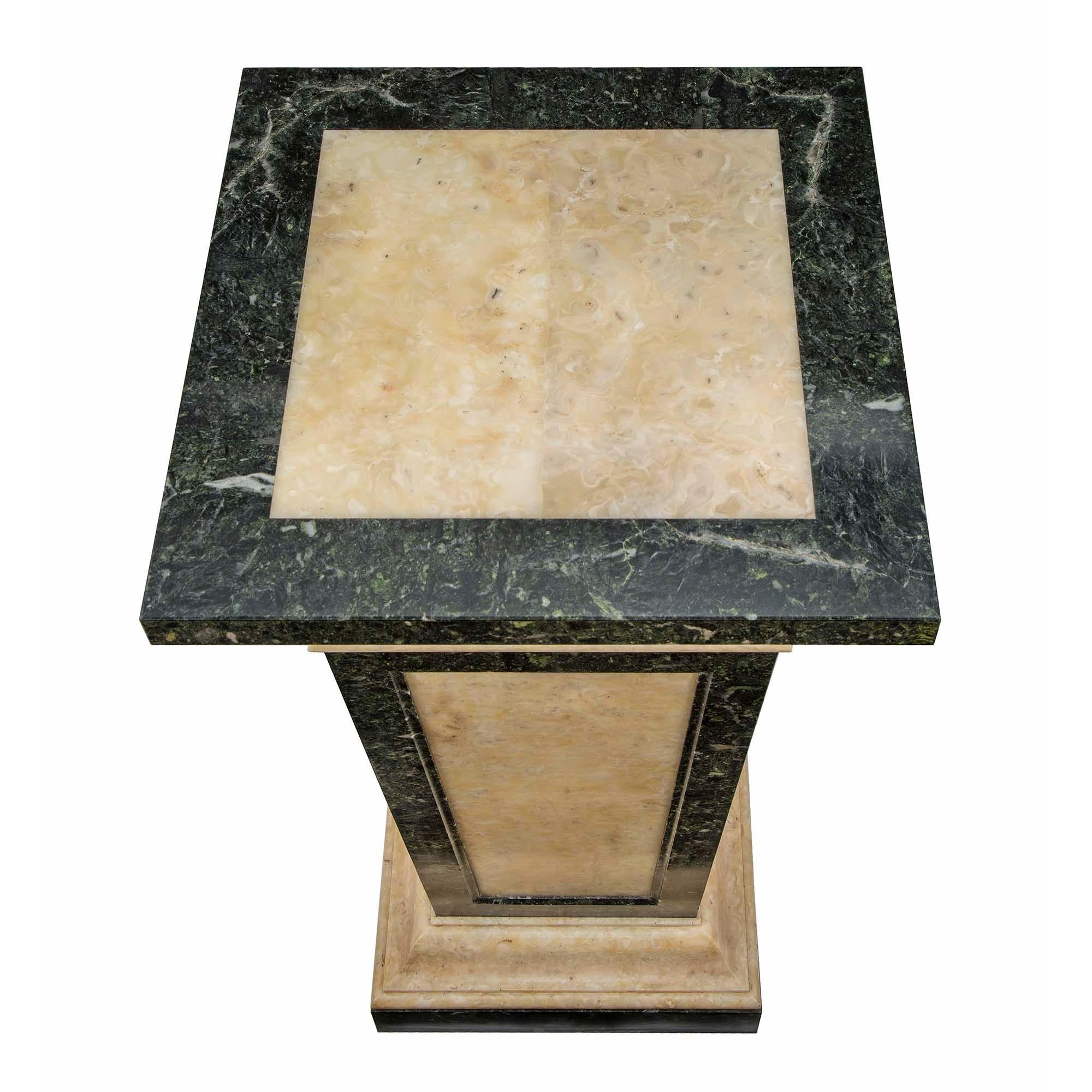 A very handsome Italian late 19th century neo-classical st. alabaster and marble pedestal. The pedestal is raised on a Vert de Patricia square support with moulded stepped alabaster base. The tapered marble column is centered with fitted alabaster