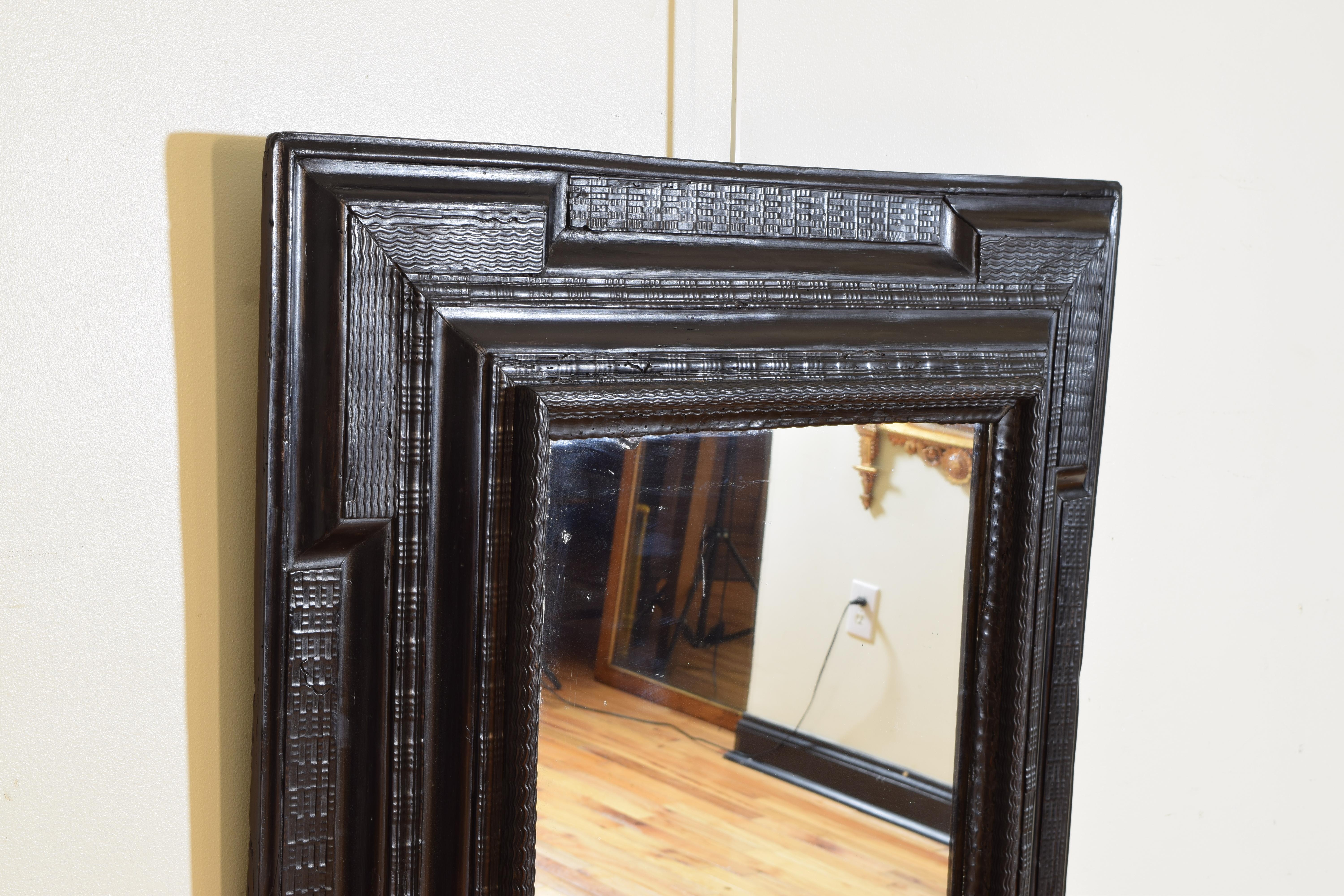 Hand-Carved Italian Late Baroque Period Carved and Ebonized Guilloche Mirror, ca. 1700 For Sale