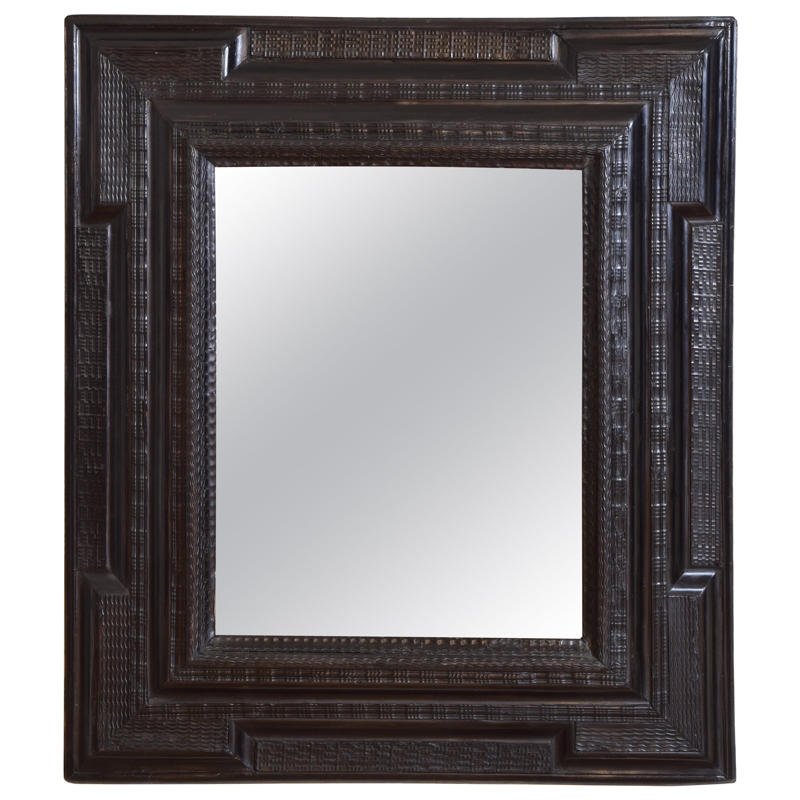 Italian Late Baroque Period Carved and Ebonized Guilloche Mirror, ca. 1700