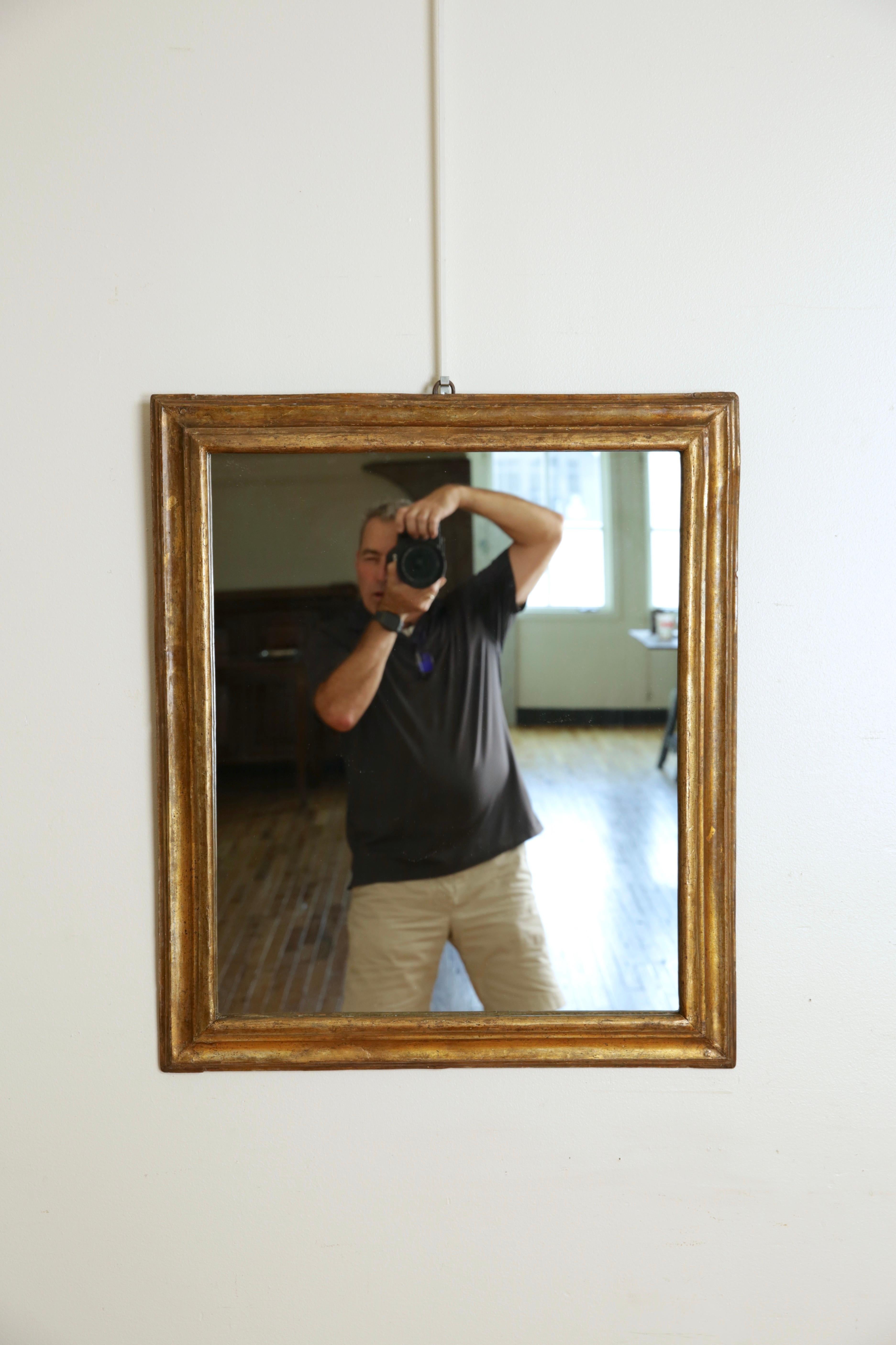 Of rectangular shape and having three distinct molded sections of graduated form, now fitted with a modern mirror plate