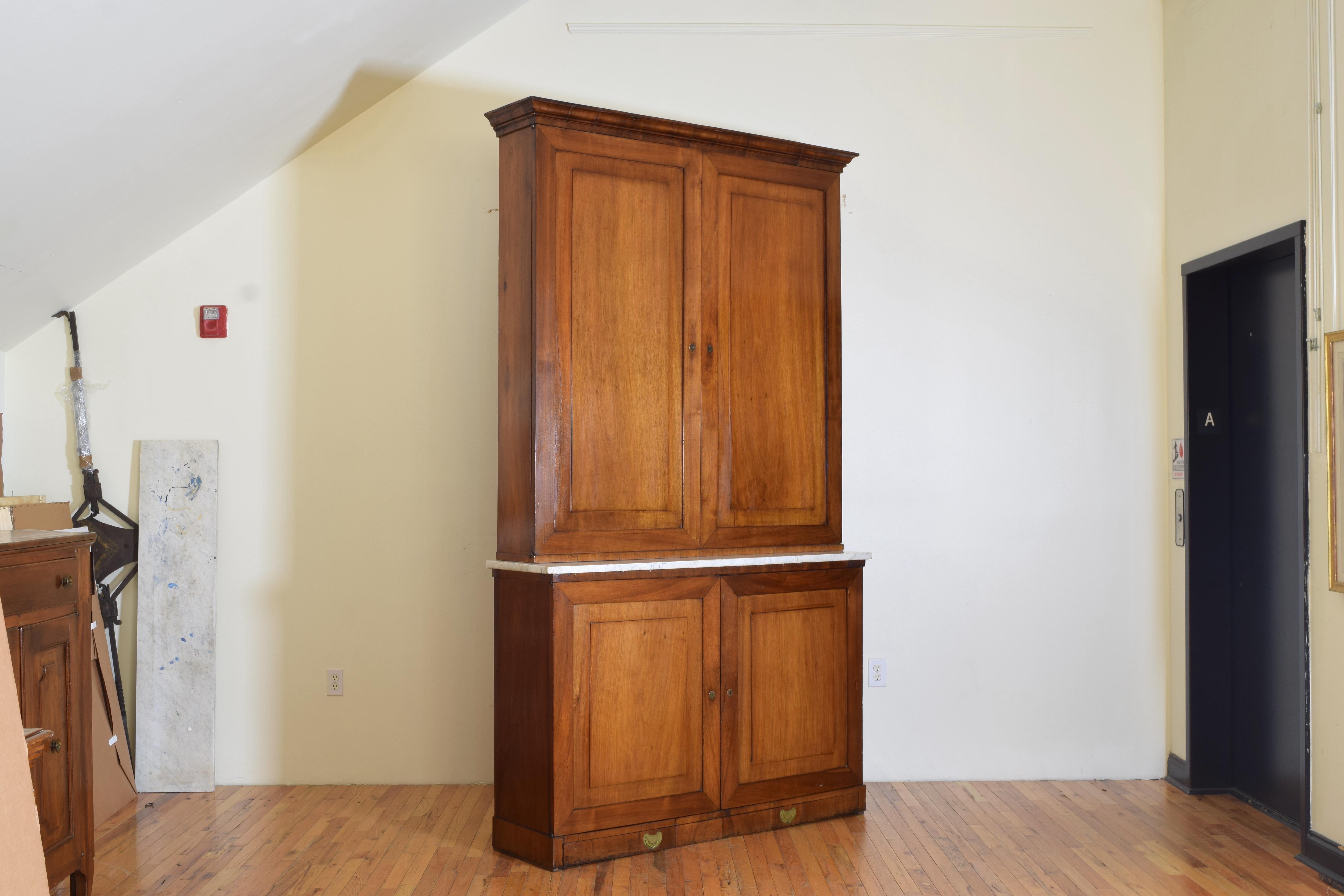 currently in a fine home in Genova, Italy this two part cabinet has a thick slab of Carrara marble between the sections, the bottom cabinet has been reduced in depth and opens to reveal a single shelf, the upper section opens to reveal and painted