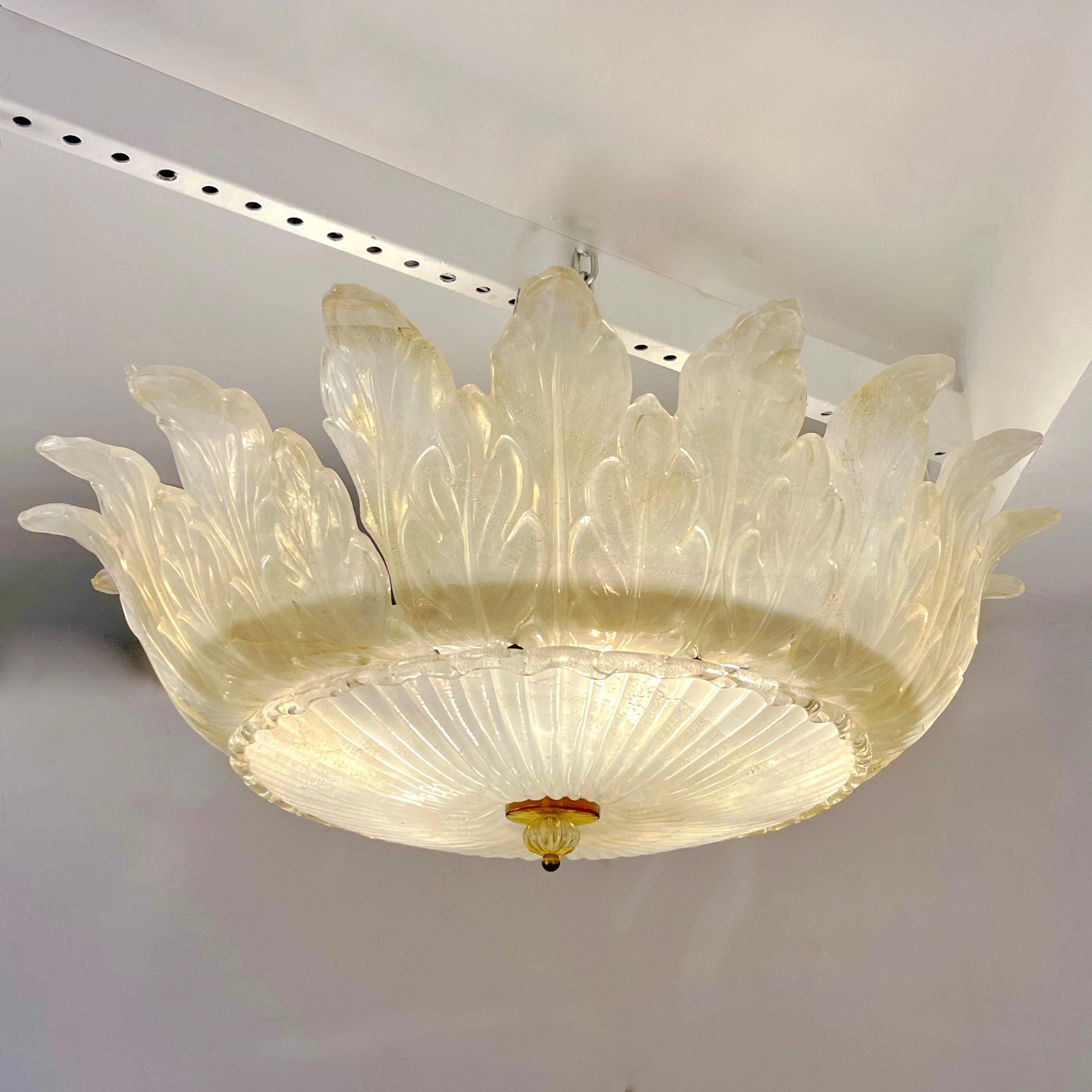 Vintage ivory transitional flush mount chandelier with highly decorative technique applied to the Murano glass, worked with pure gold and iridescent translucence that gives an exceptional pearl silk finish. The short drop makes this also ideal as a