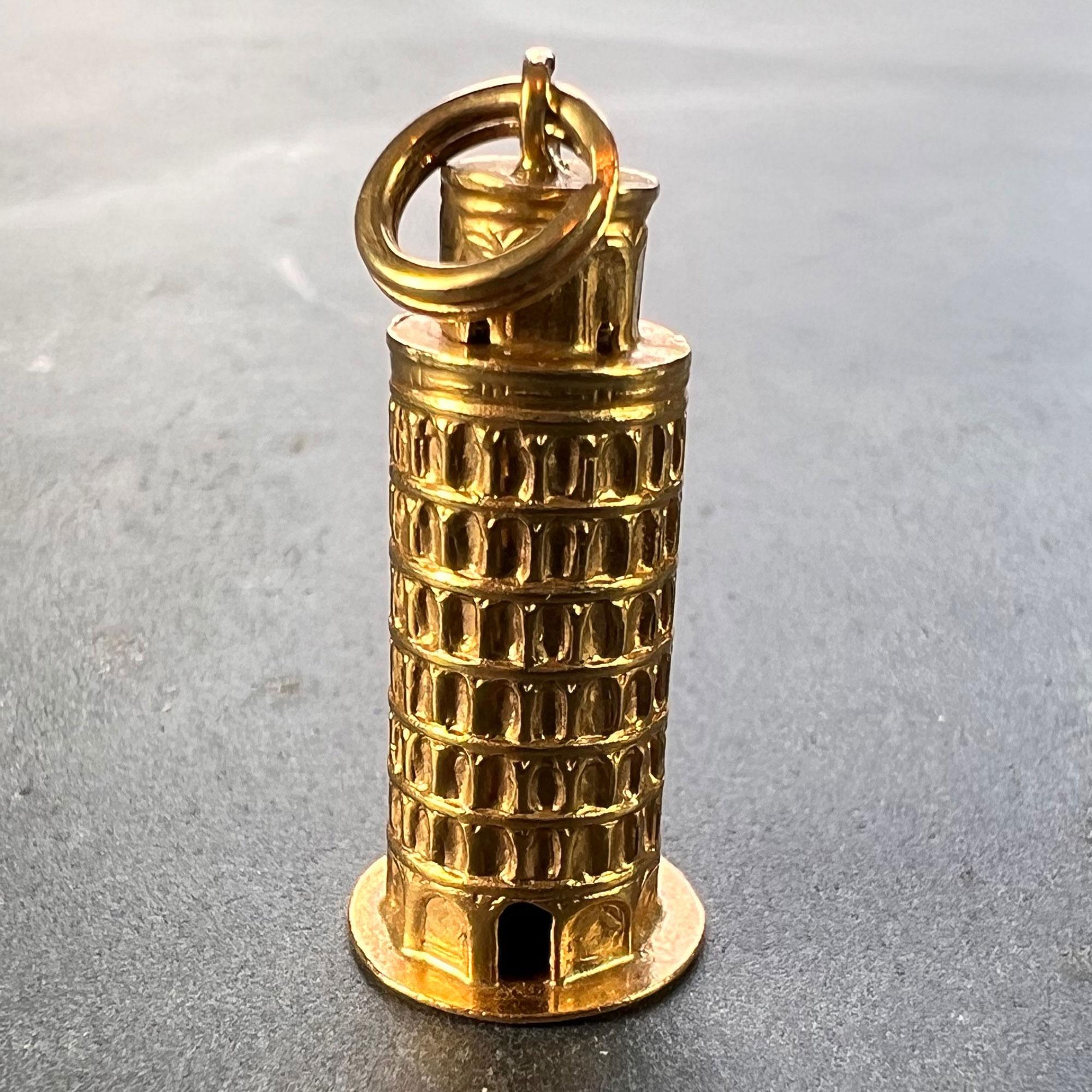 An 18 karat (18K) gold charm pendant designed as the Leaning Tower of Pisa, Italy. Stamped with the French import mark for 18 karat gold.

Dimensions: 2.5 x 1.05 x 1.05 cm (not including jump ring)
Weight: 3.42 grams
(Chain not included)