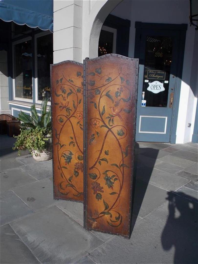 Italian leather arched three panel floral vine and centered urn folding screen with exterior brass tacks and painted re verso. Late 19th century
Each panel on screen is 18 wide.