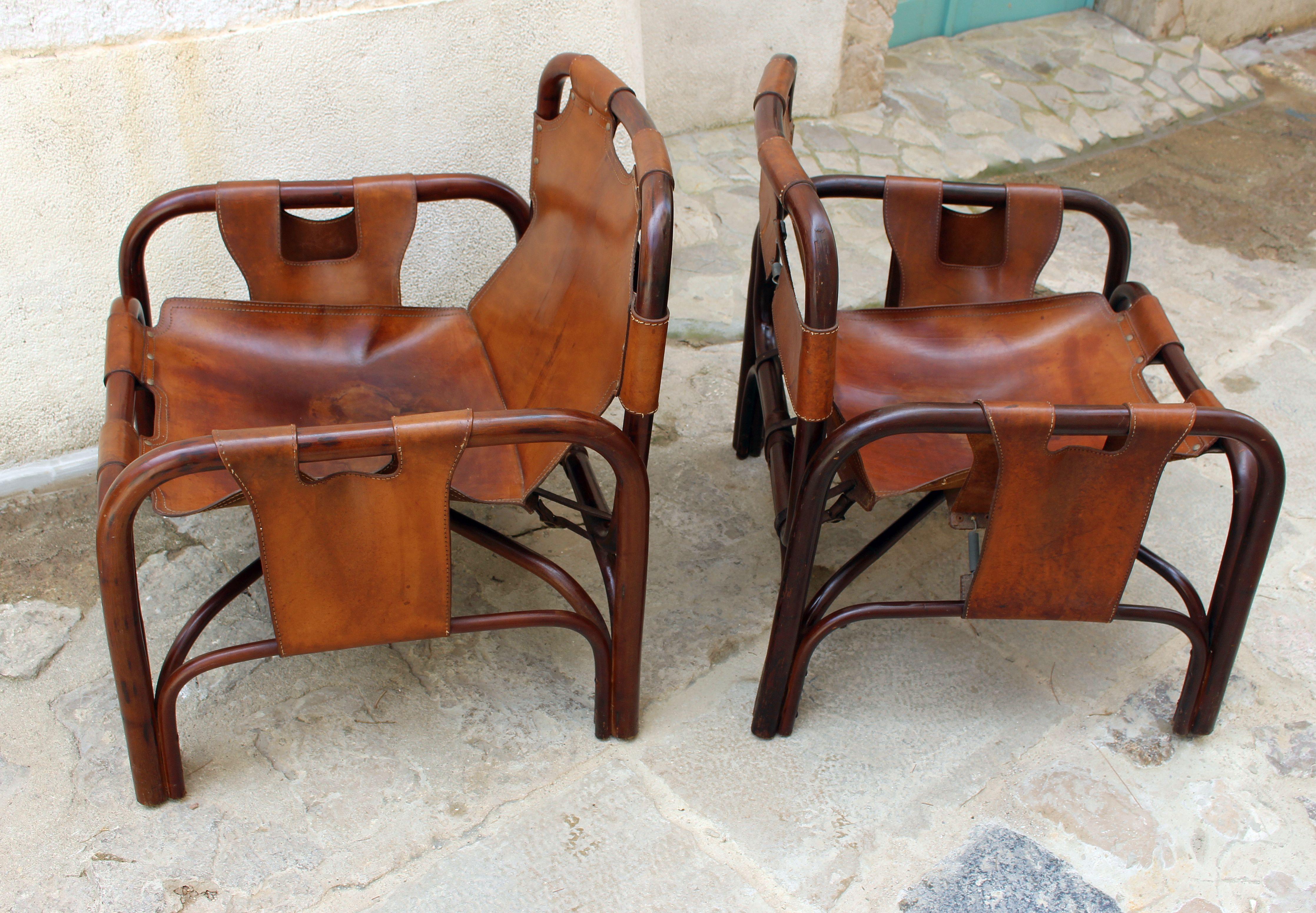 Pair of Bonacina mid century  bamboo and brown leather Italian Armchairs, from the 1960s. Designed by Tito Agnoli 
