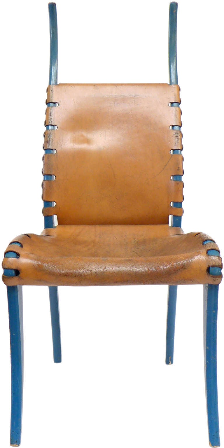 A wonderfully unusual and elegant lacquered wood and leather side chair. Fantastic sculptural form and exaggerated scale. Original blue lacquer and leather with a beautifully worn surface patina. A very exotic and special seating option with big