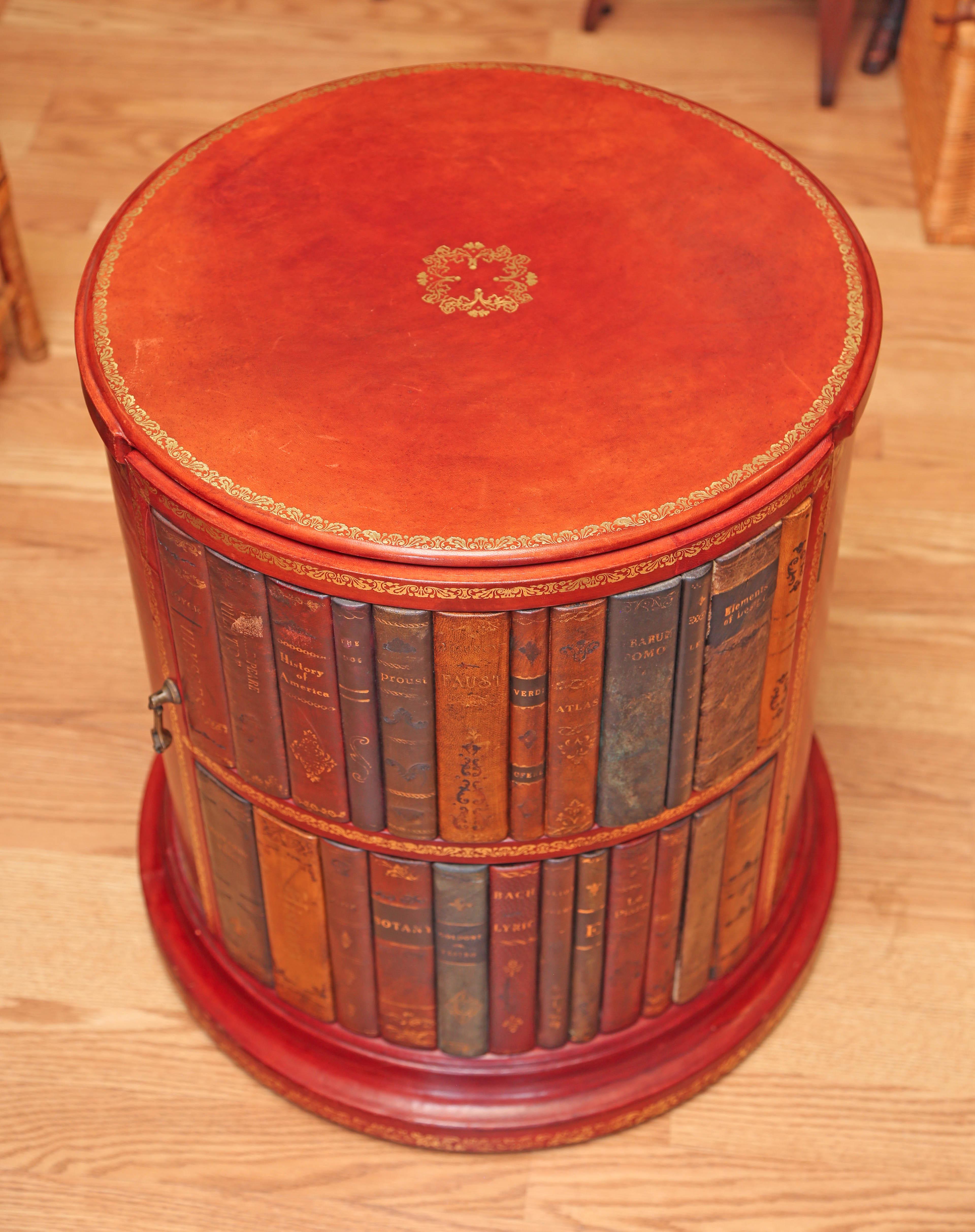 Genuine embossed leather covered library drum table with one door for storage.
